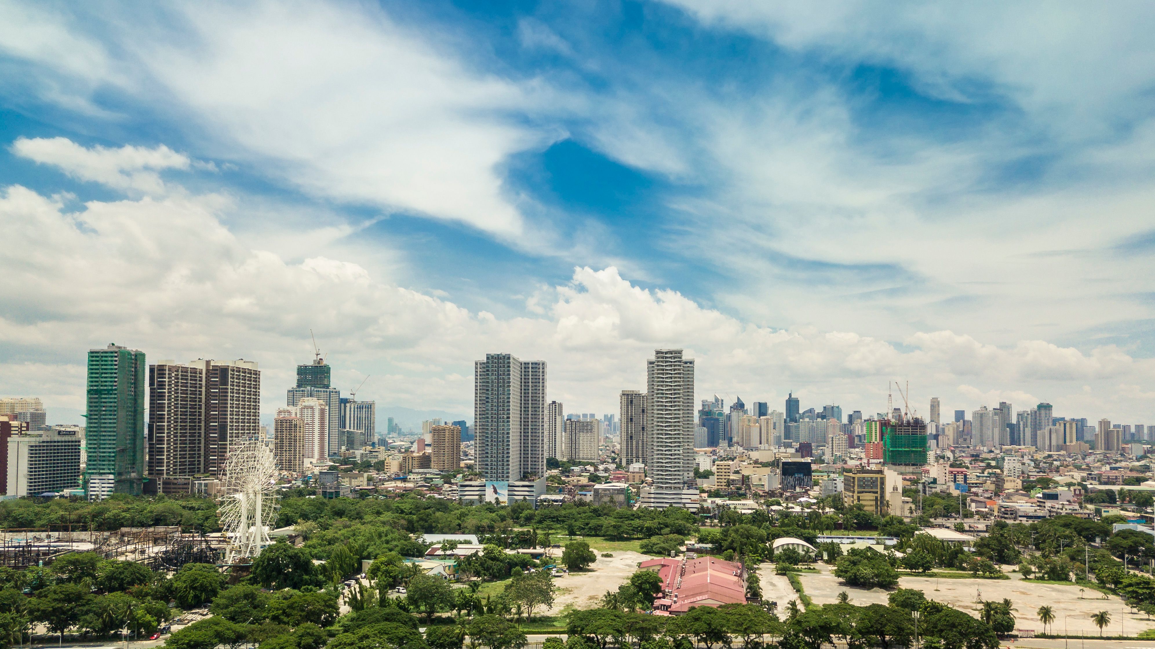 Manila, Philippines - Condominiums along Roxas Blvd. Makati City skyline at the background.