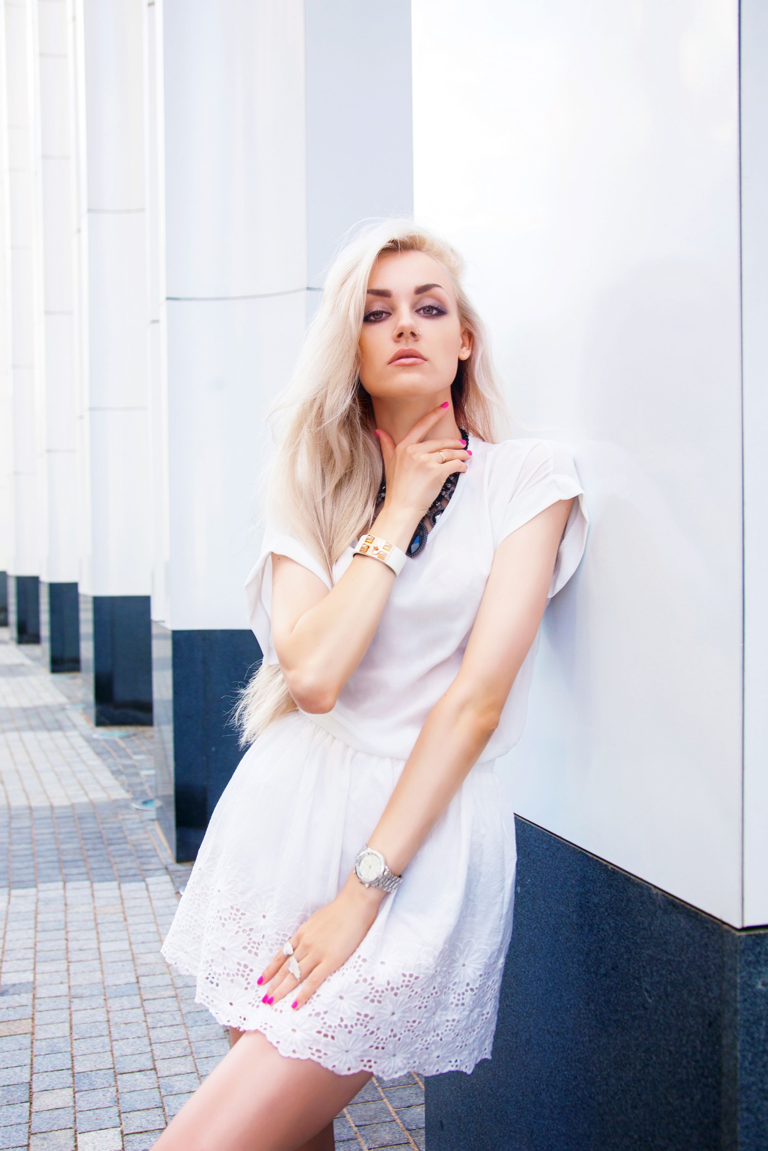 Stylish young woman posing outdoors Stylish young woman posing outdoors