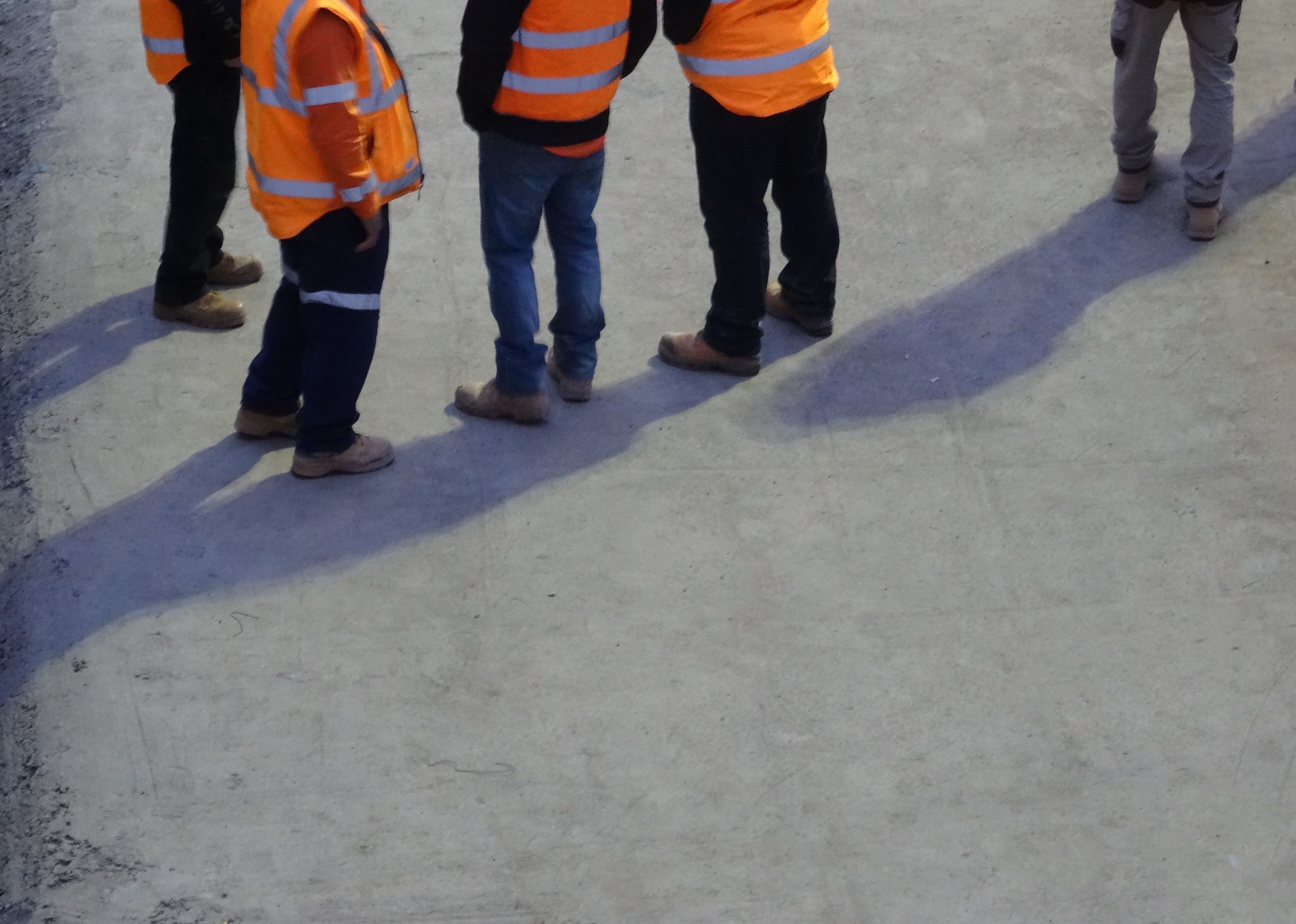 team assessing pavement