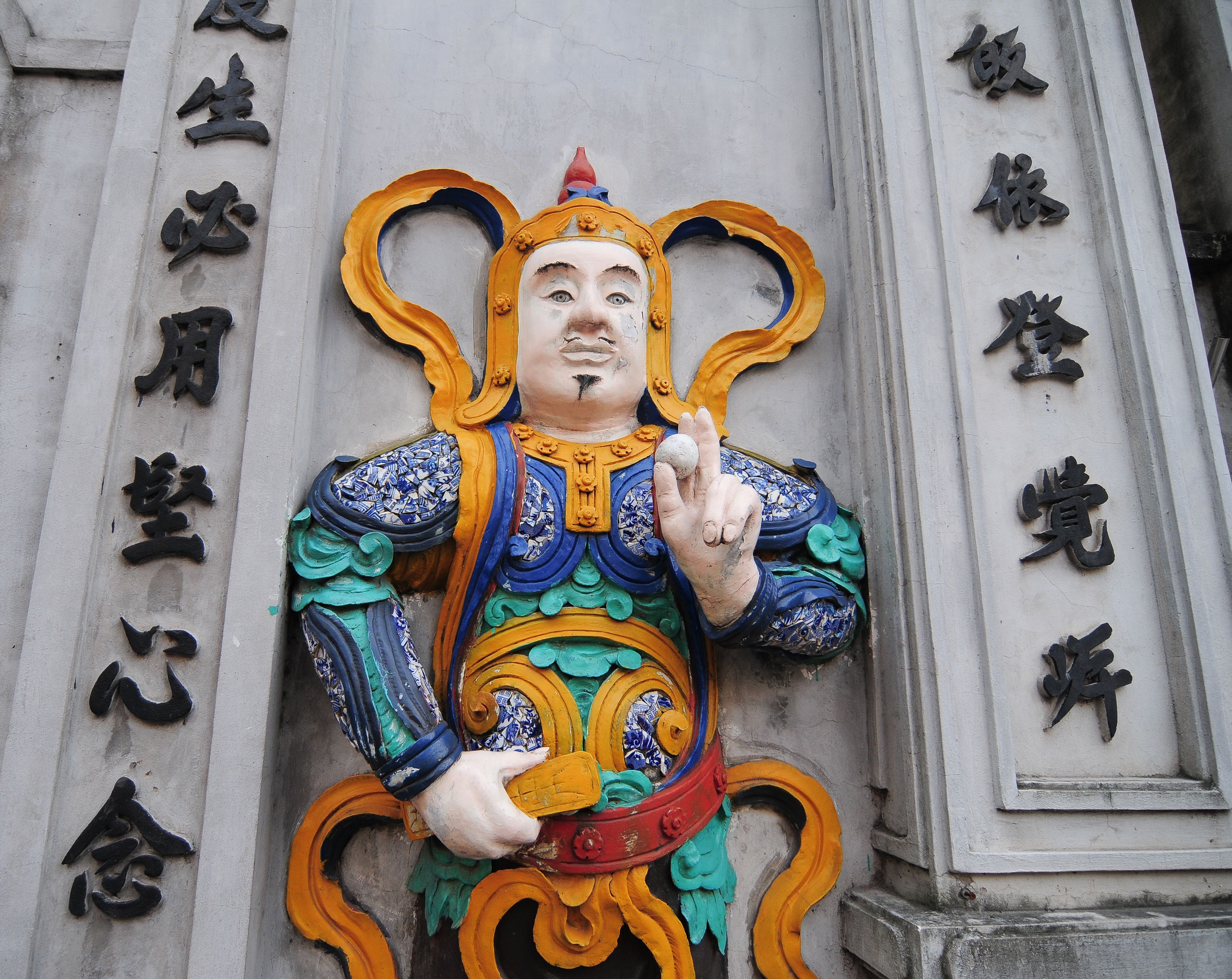 God statue at old temple in Hanoi, Vietnam