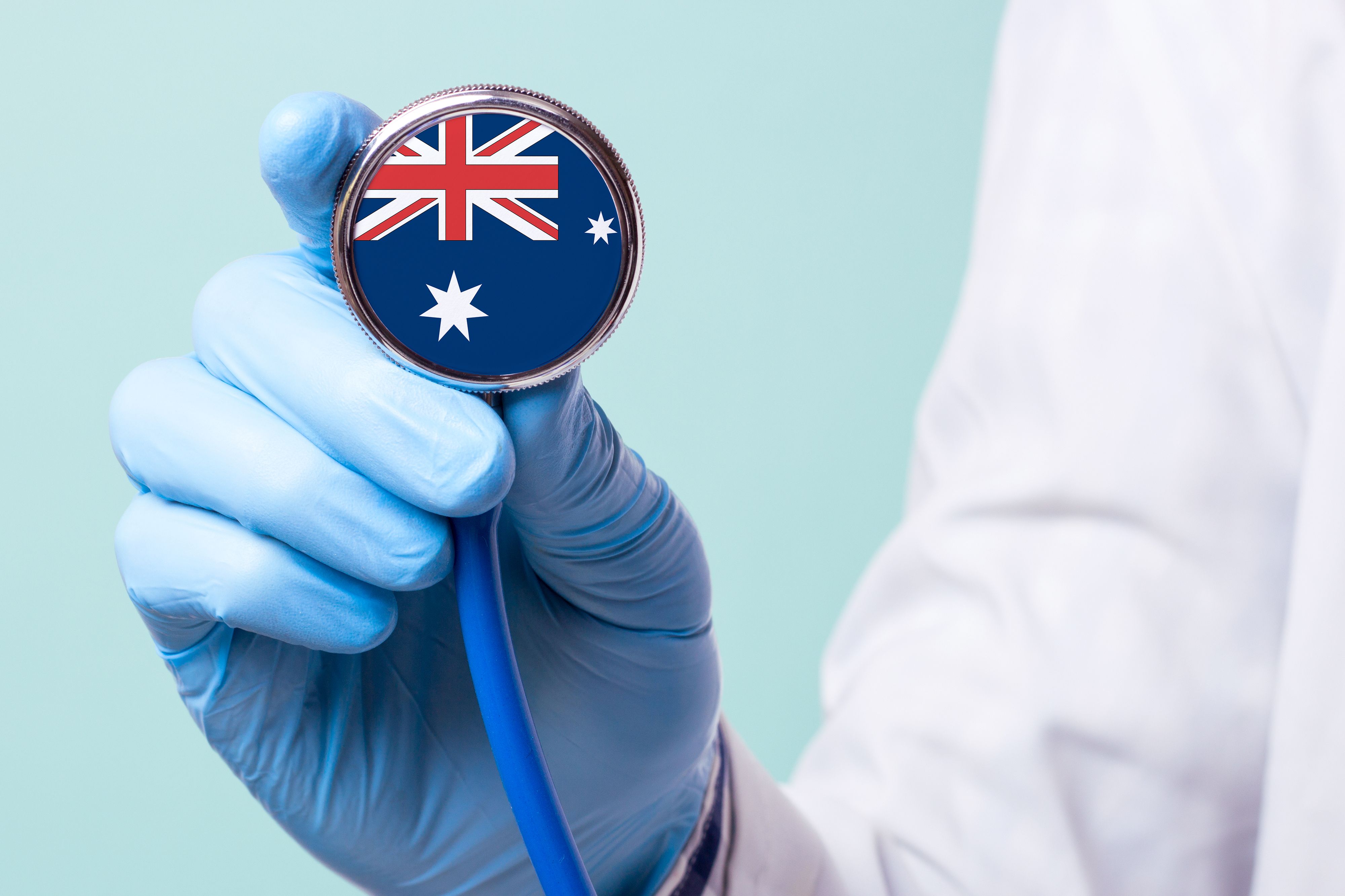 Medicine in Australia is free and paid. Expensive medical insurance. Treatment of disease at the highest level Doctor holding a stethoscope in his hand Medicine in Australia is free and paid. Expensive medical insurance. Treatment of disease at the highest level Doctor holding a stethoscope in his hand
