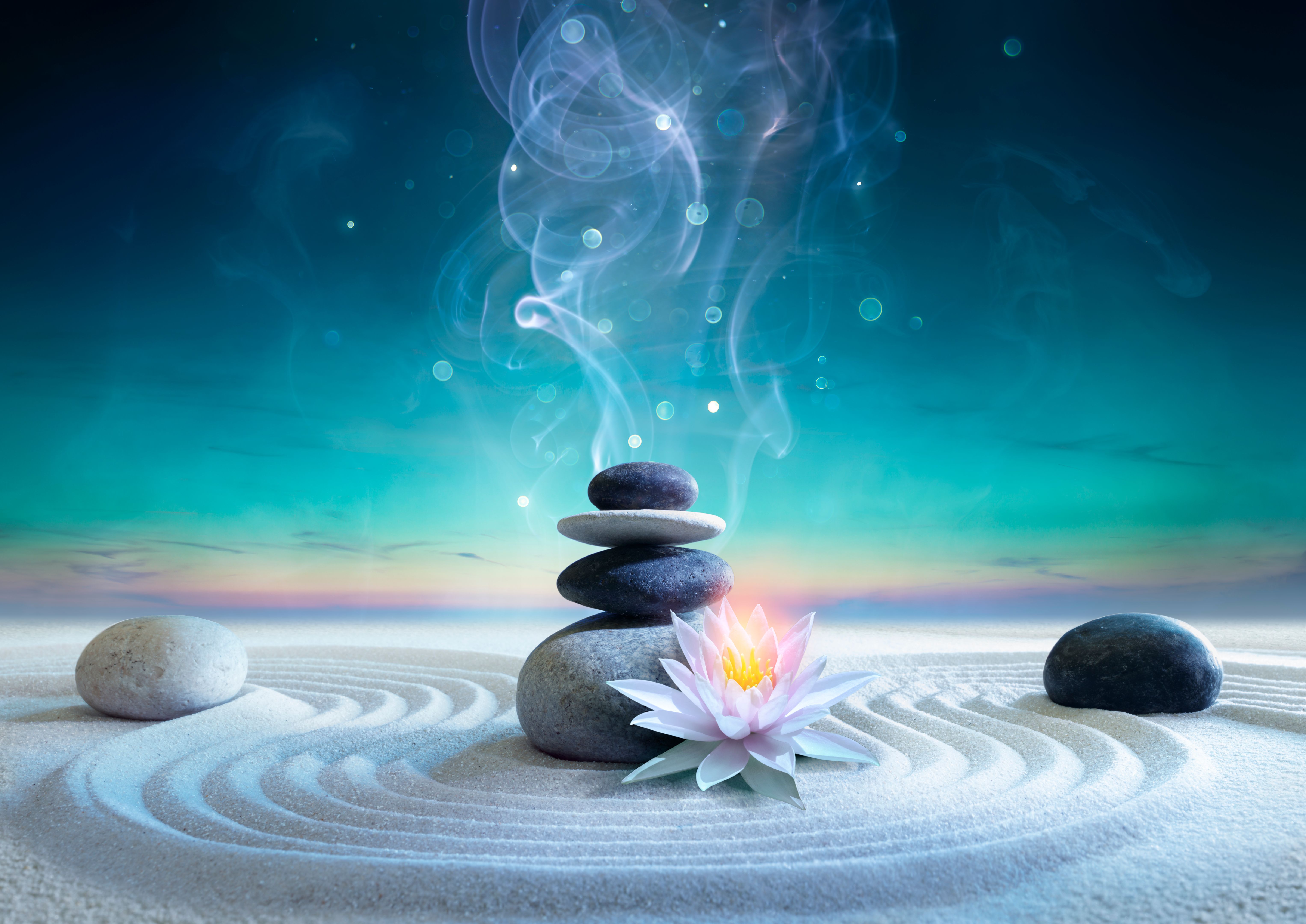 Yin And Yang Energy between Sky and Earth - Zen Concept - Stack Massage Stones On Raked Sand With Lotus And Abstract Smoke