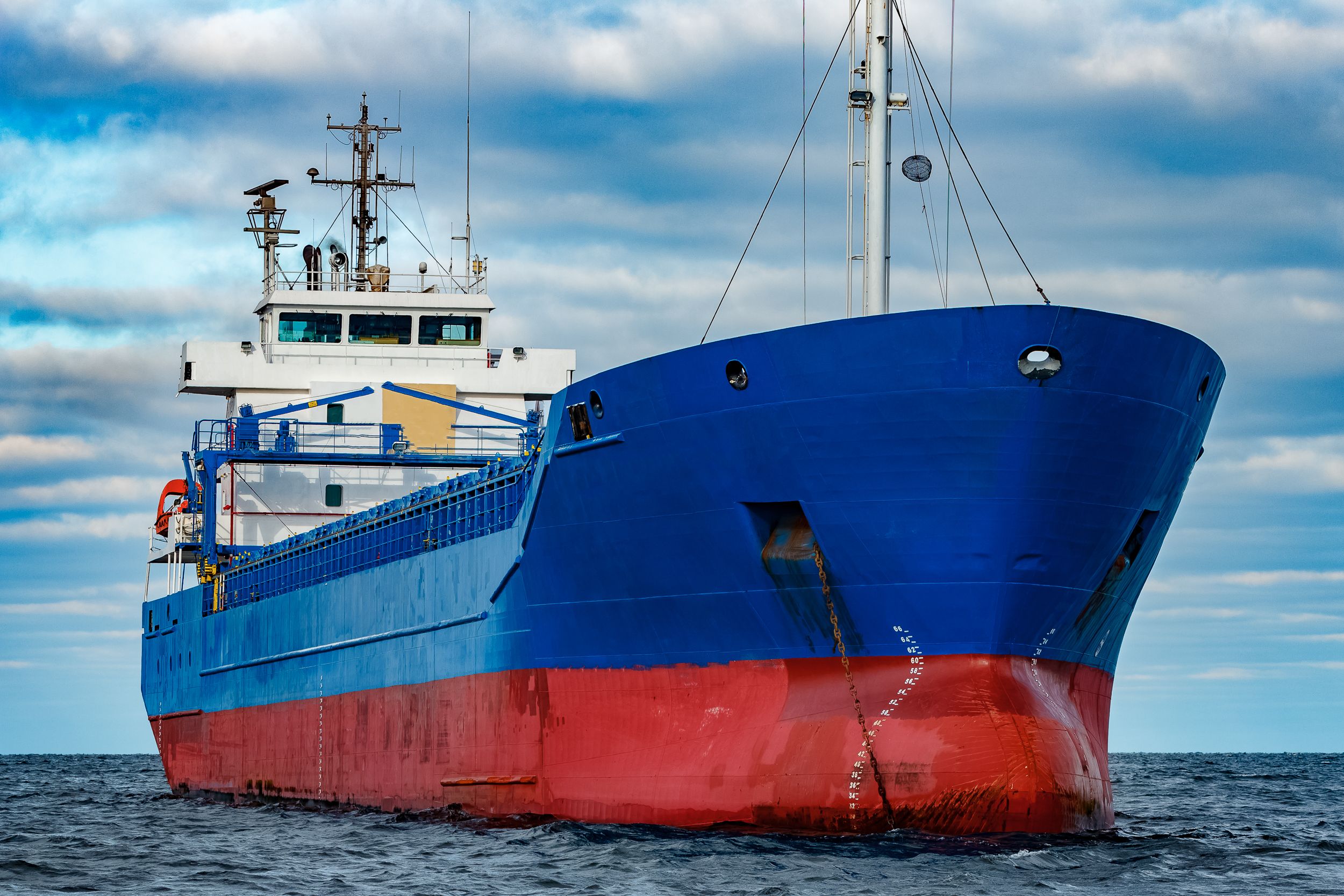 Blue cargo ship moored