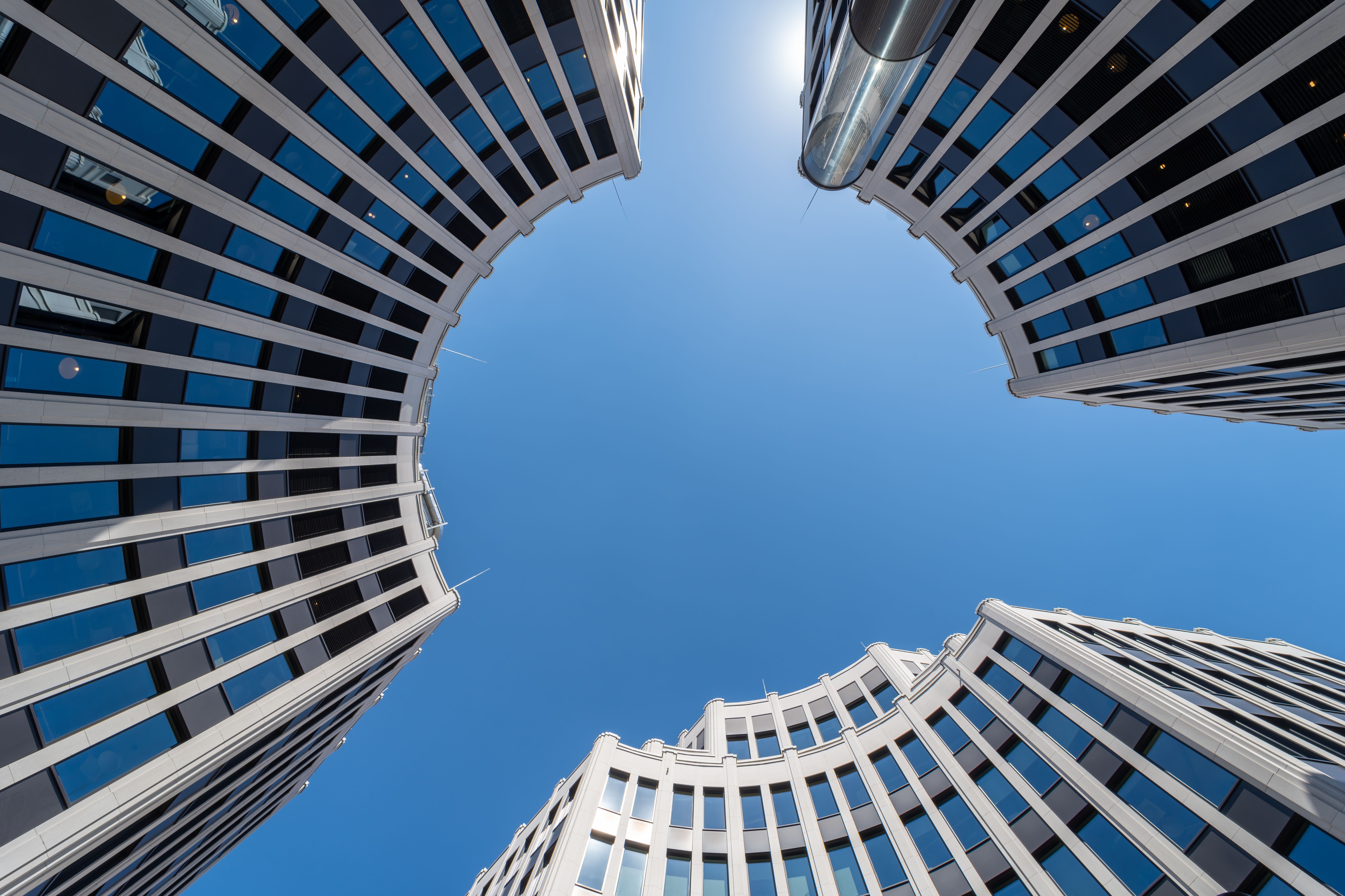 Low angle view of modern office building against clear sky