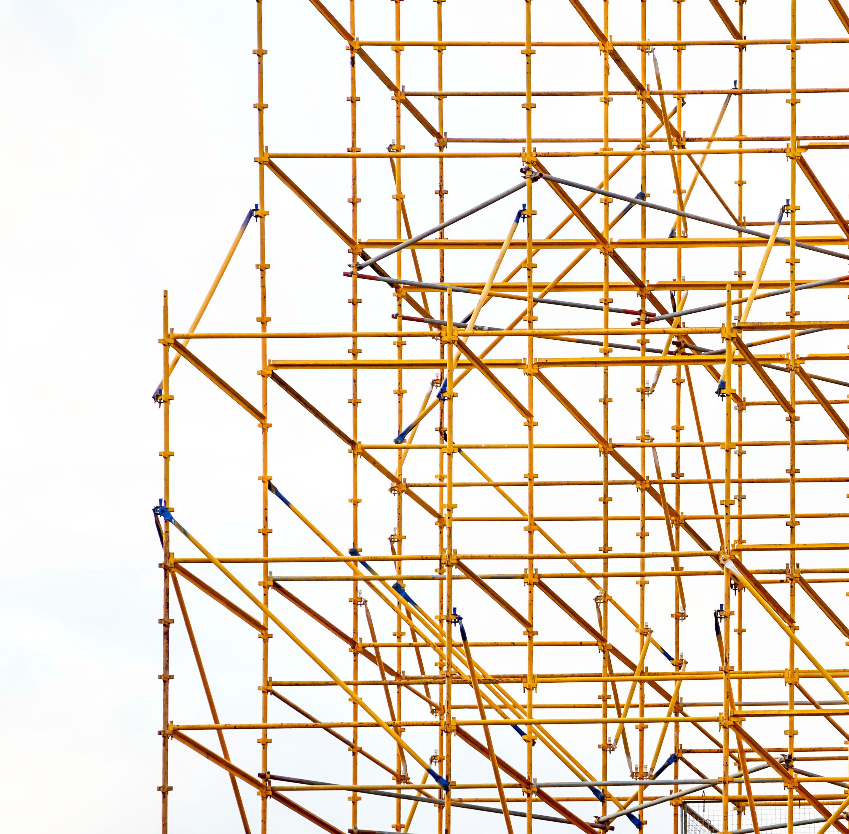 Closeup of intricate scaffolding on a large construction Closeup of intricate scaffolding on a large construction