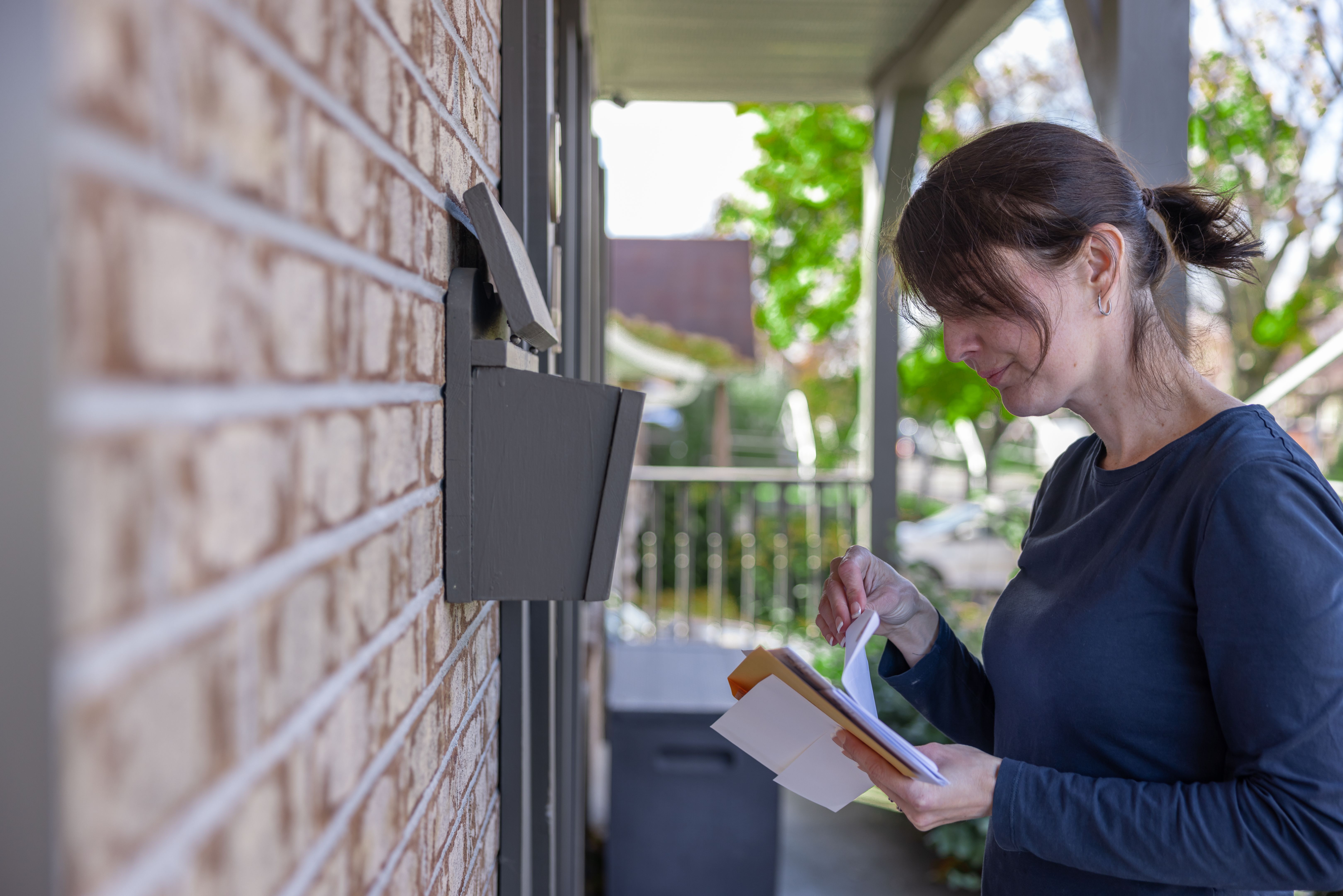 person mailing documents
