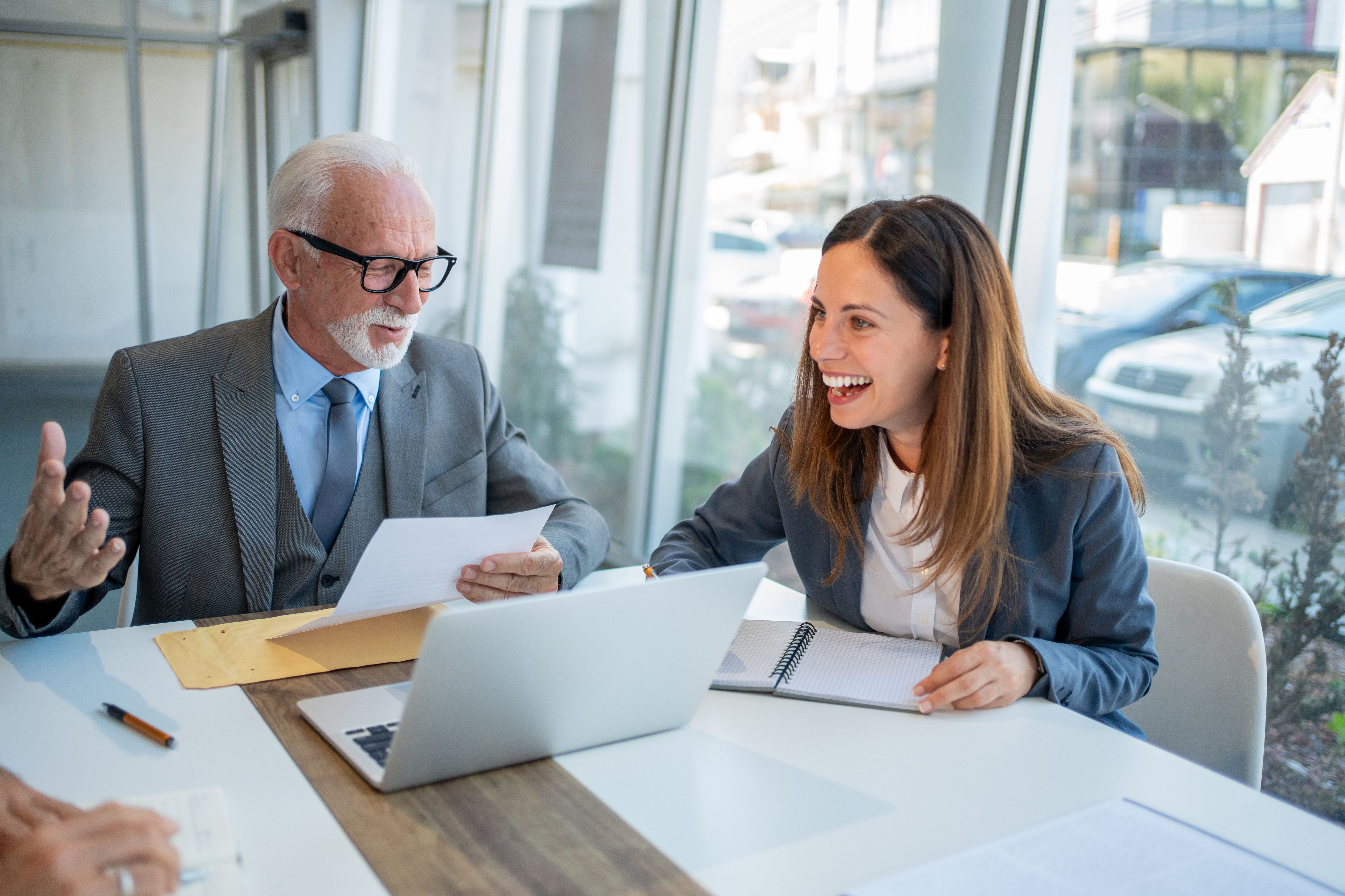Senior businessman and young businesswoman having a meeting