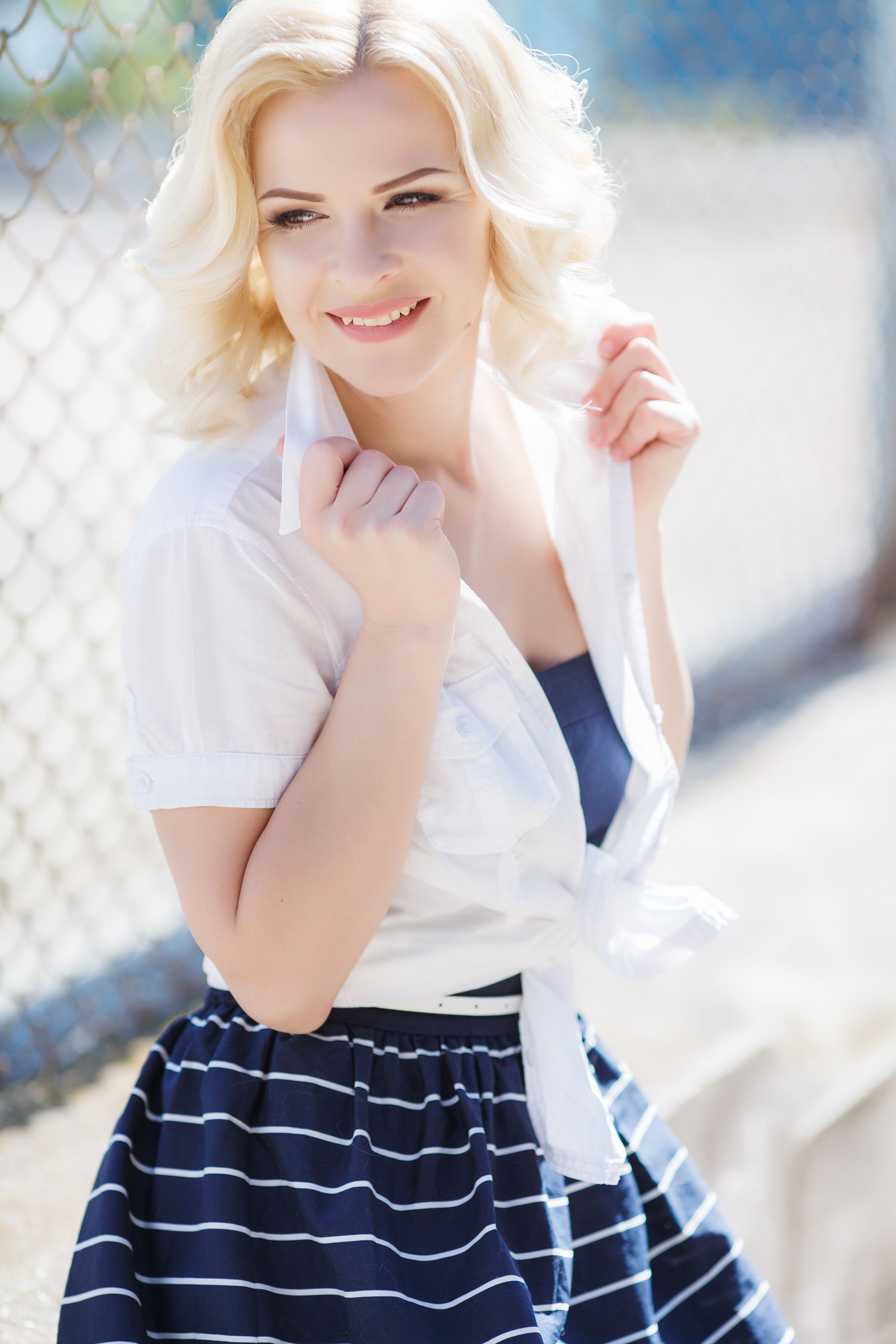 Young woman posing in summer outdoors