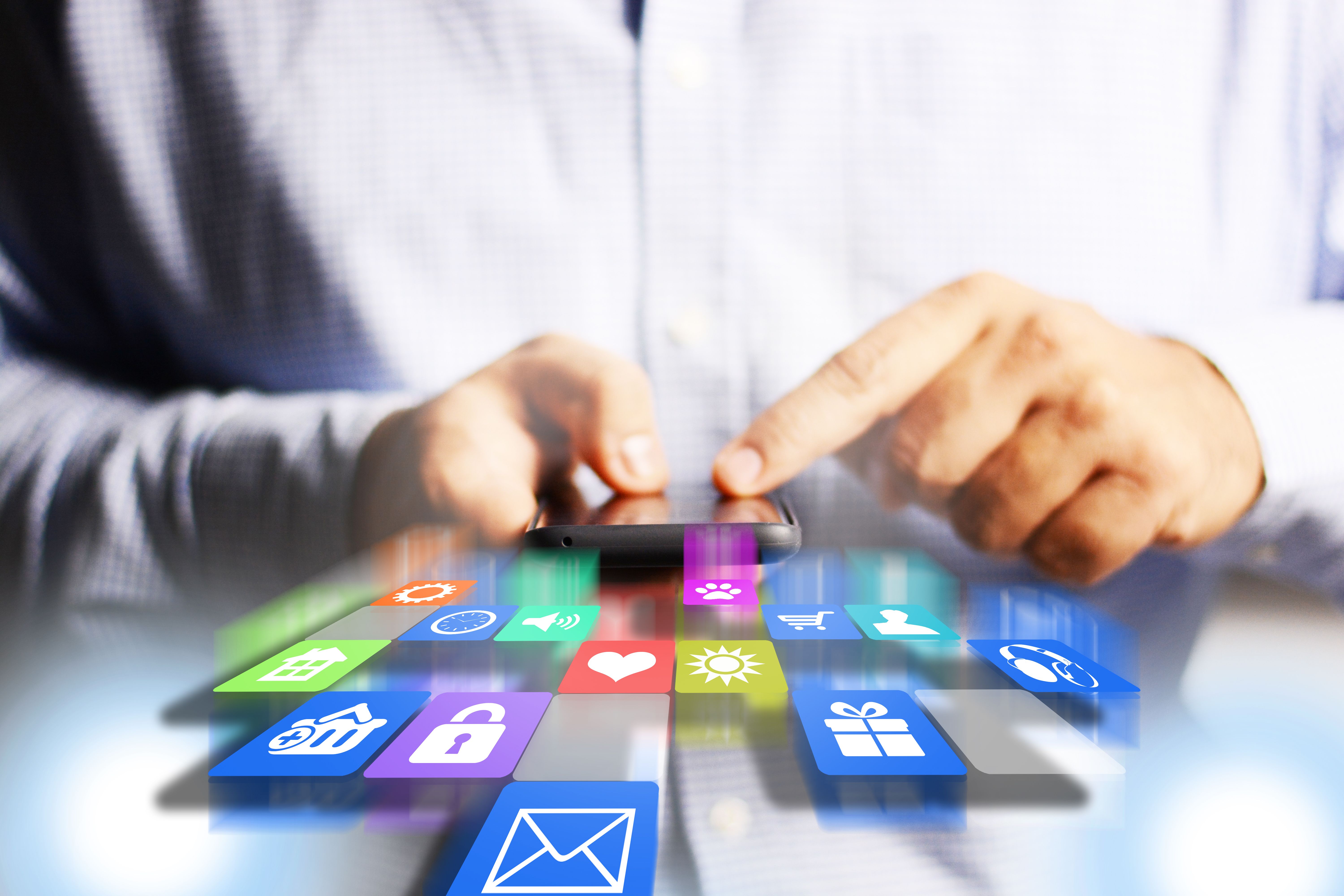 Smartphone with applications
Icons in businessman hands, apps development concept