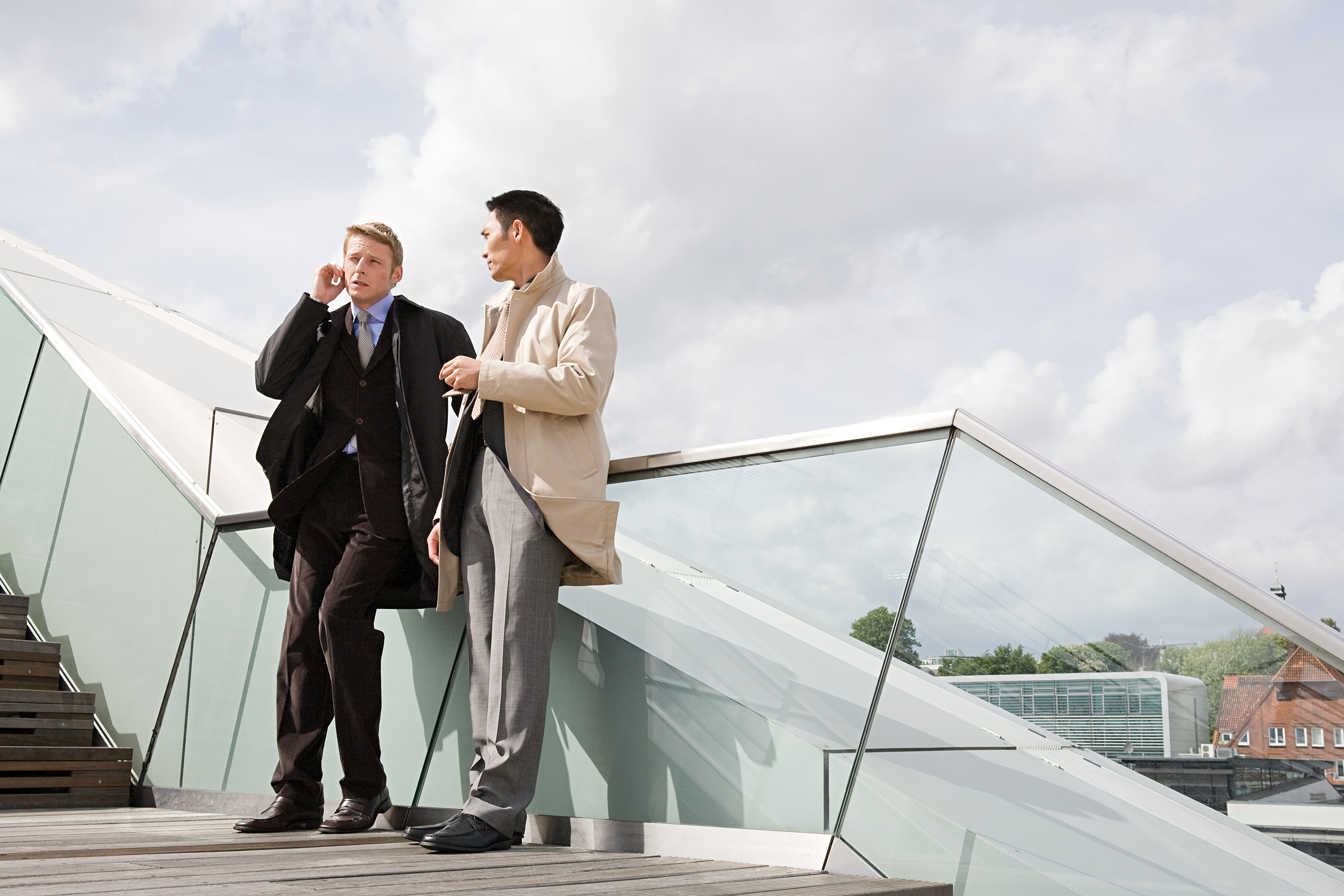 Businessmen standing on a stairway