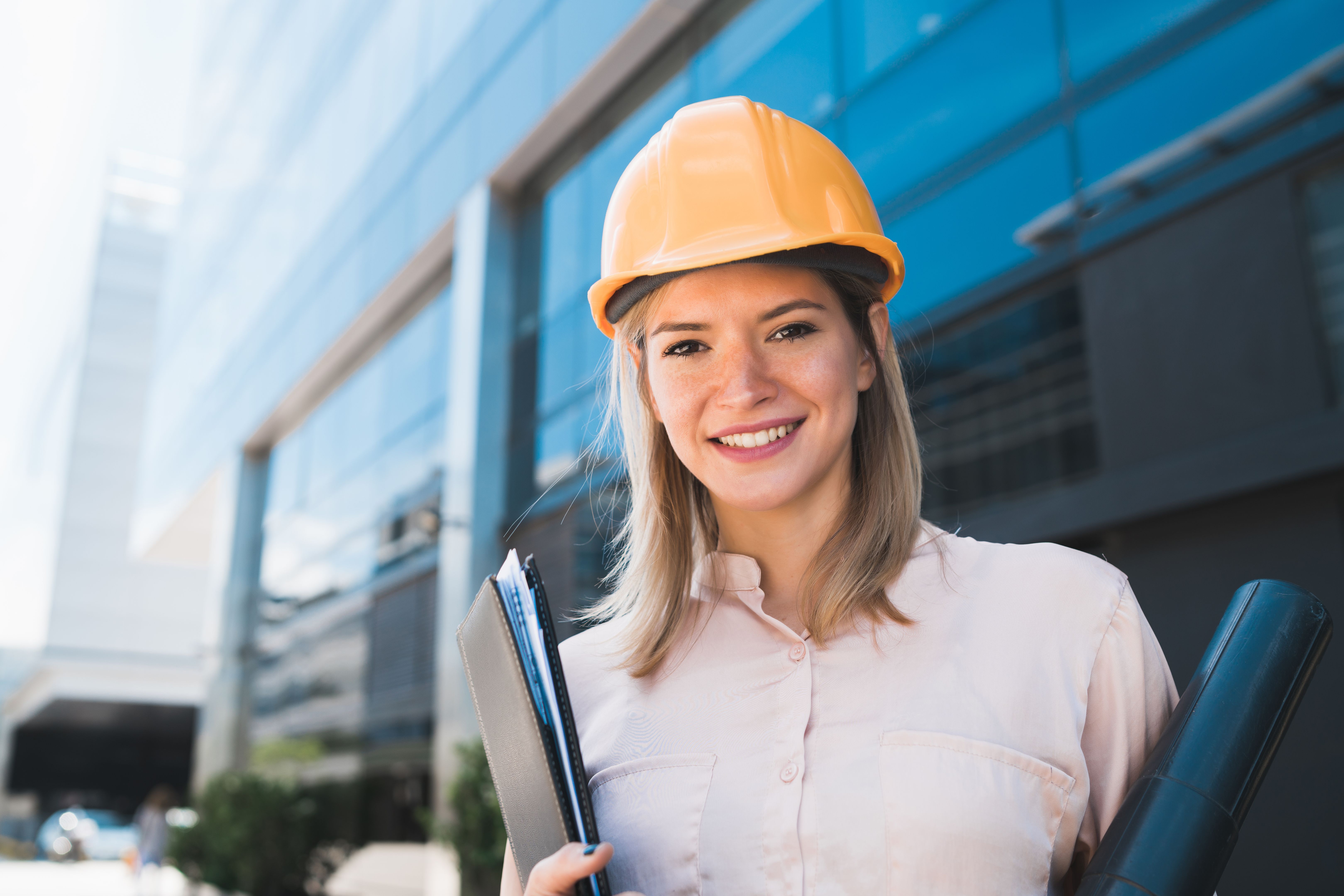 Professional architect woman standing outdoors. Professional architect woman standing outdoors.