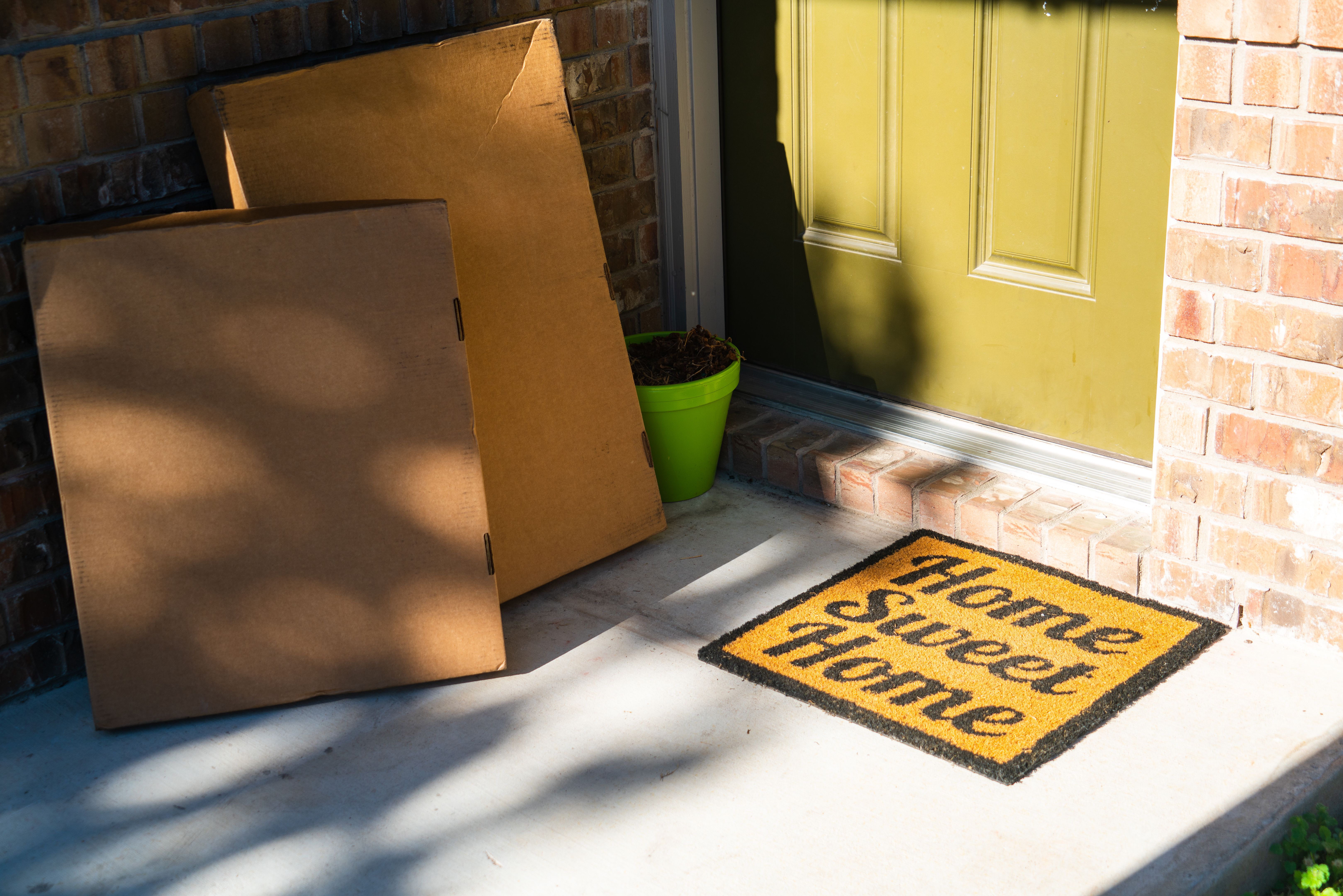 Package Delivery at Front Door with Home Sweet Home Welcome Doormat