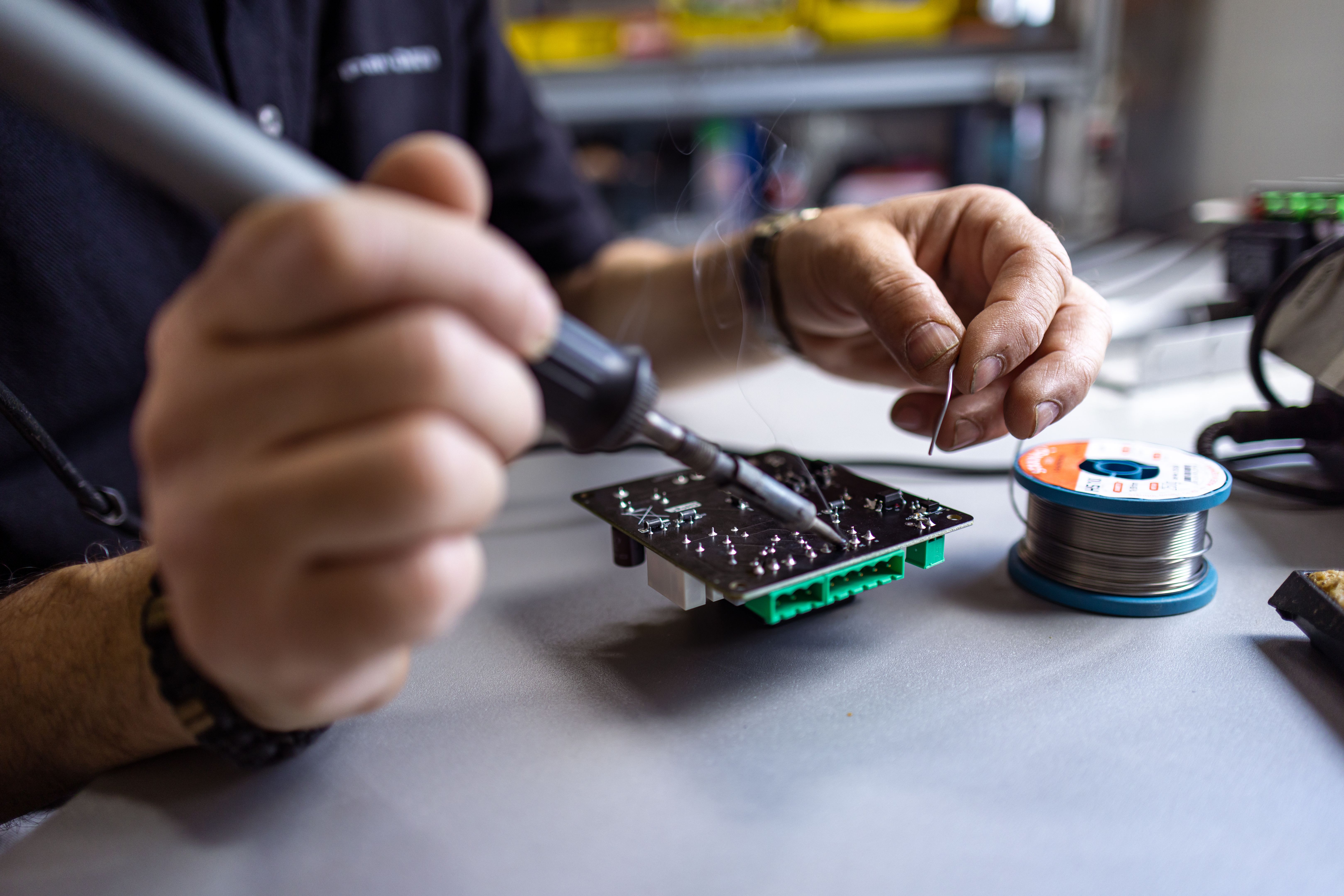 Male Technician with Soldering Iron