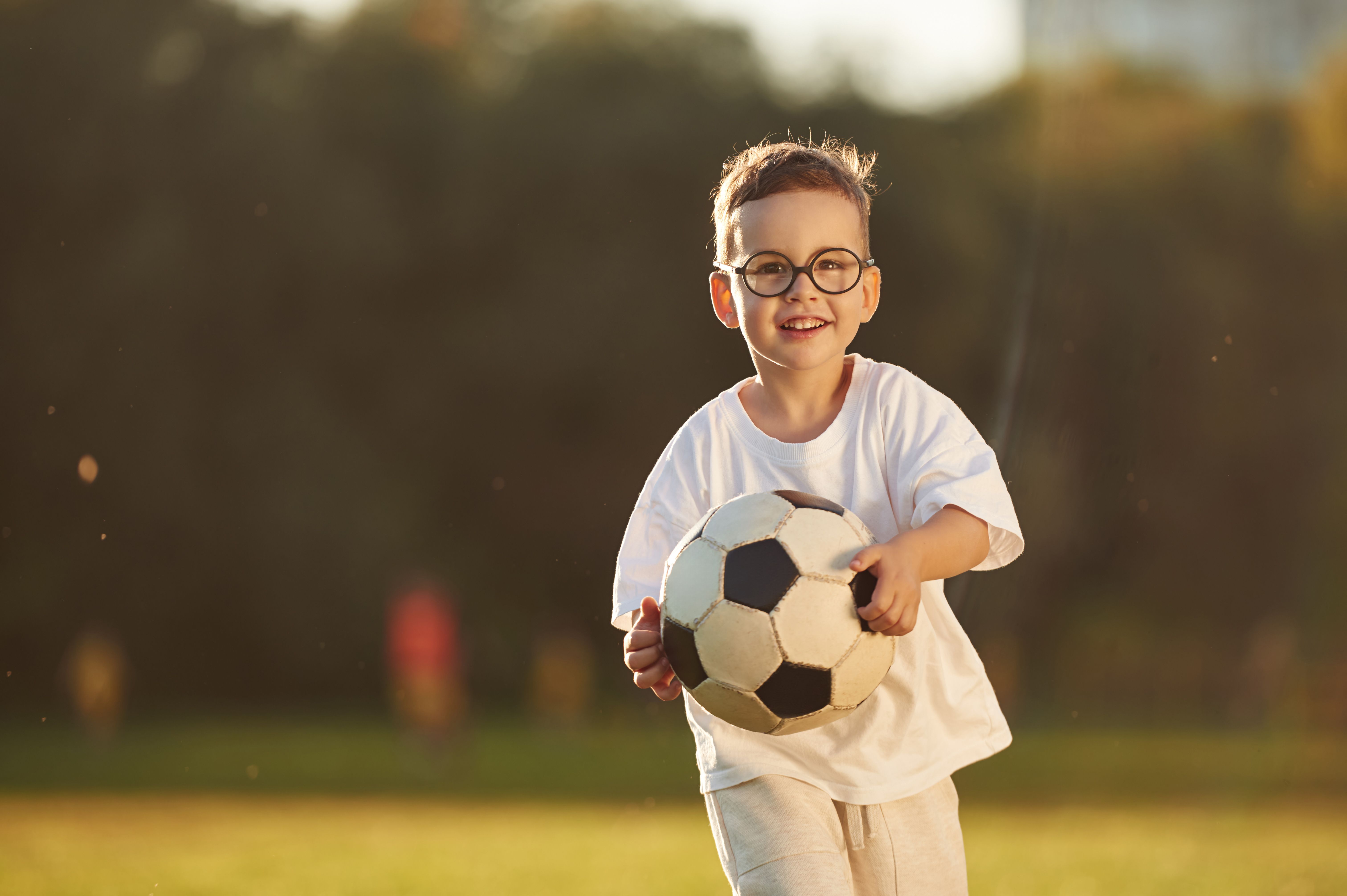 child playing soccer