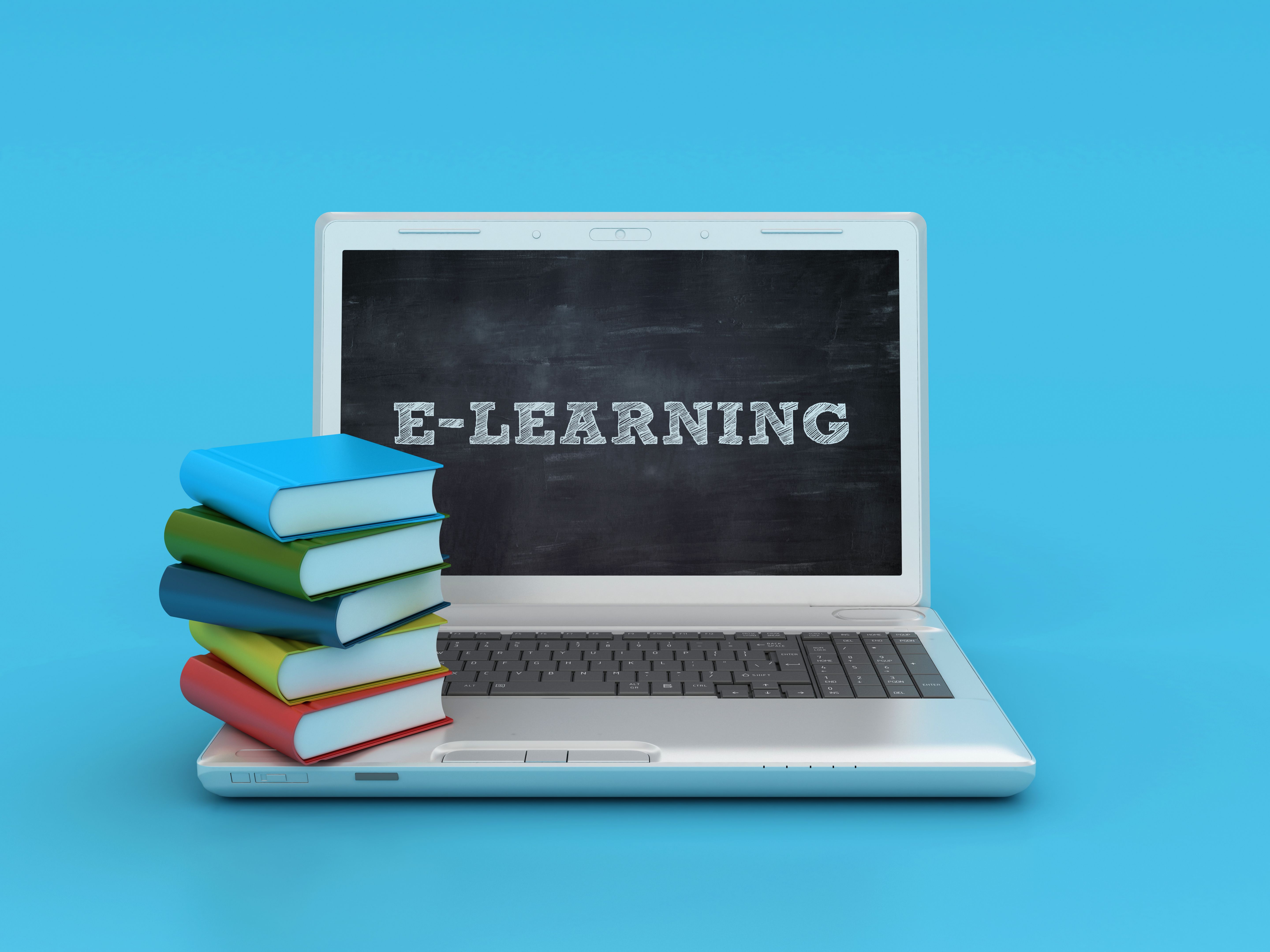 Stack of Books with E-learning Laptop