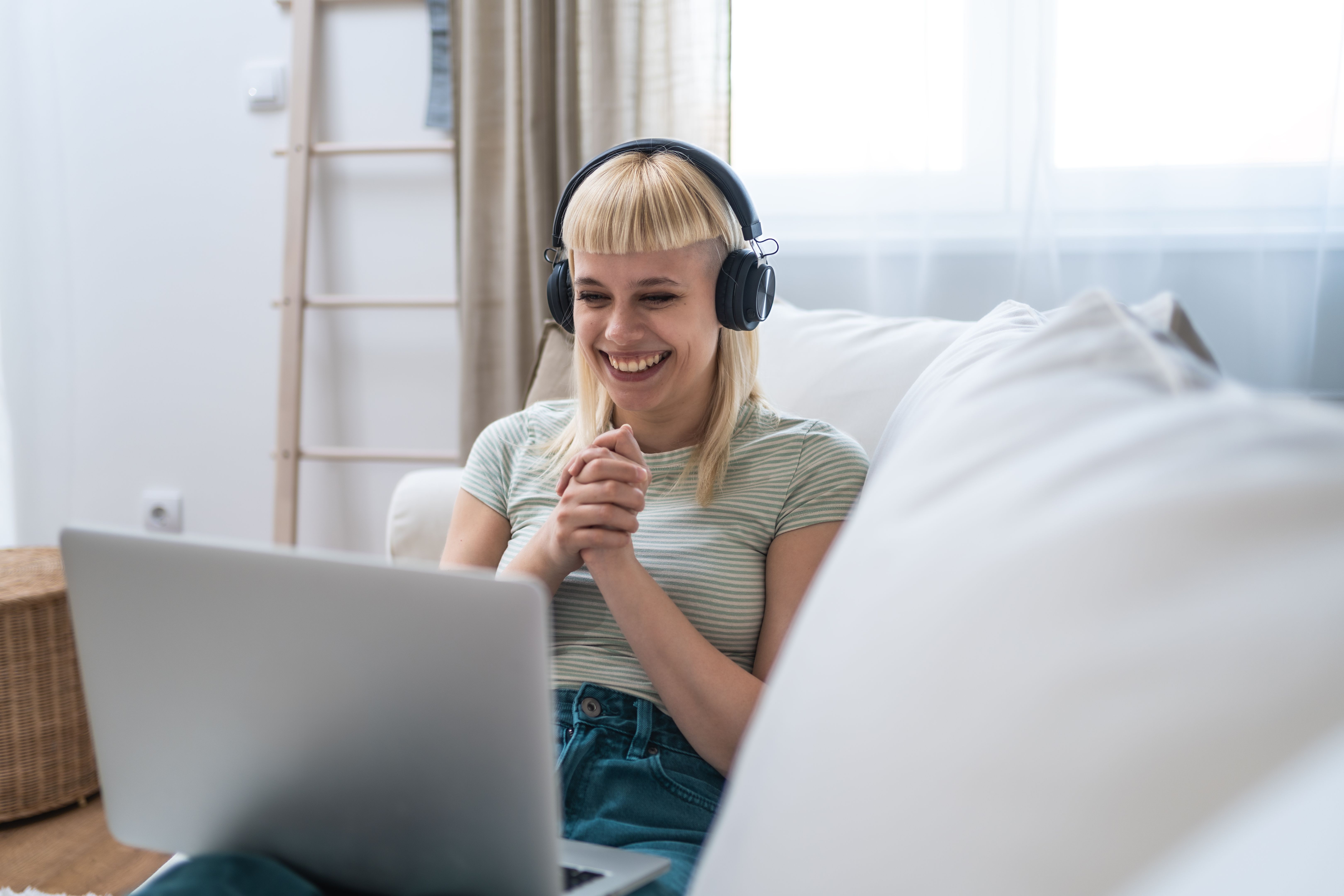 Young unemployed jobless woman sitting at home hoping for easy money and quick cash earnings from internet, work online for passive income paid surveys website surfing click for cash affiliate program