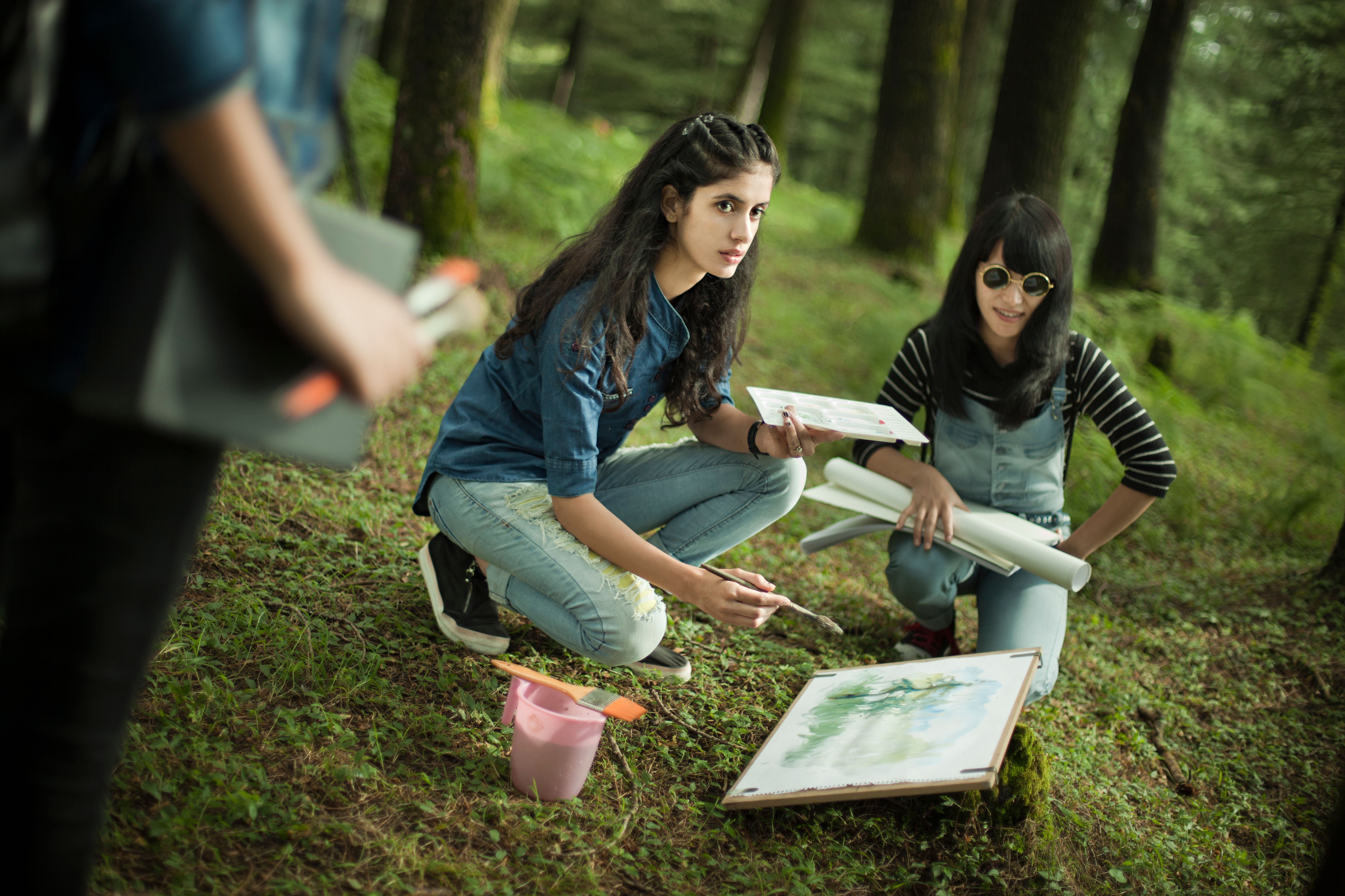 students painting nature