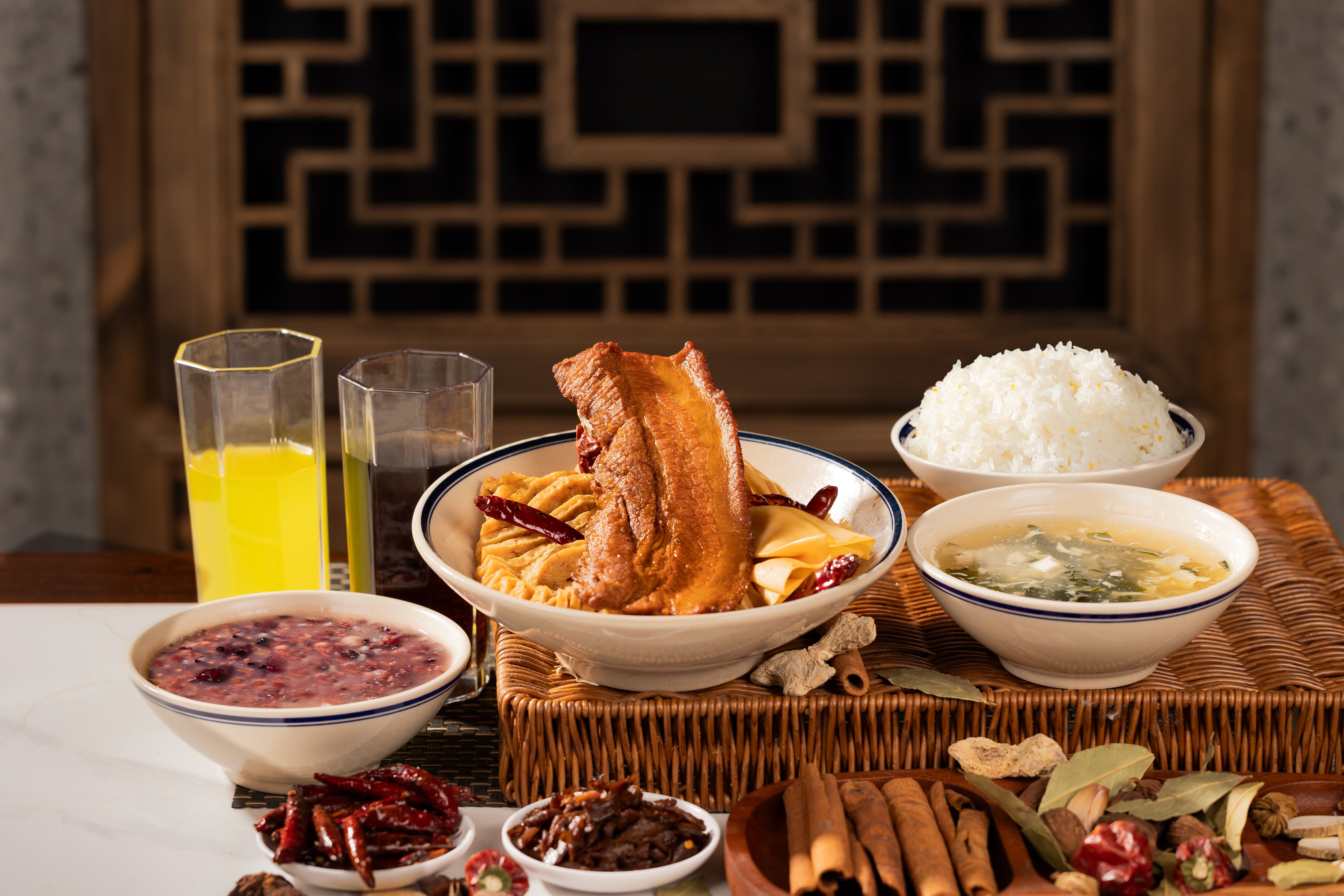 Traditional Chinese food on the table, meat, rice, porridge and various spices