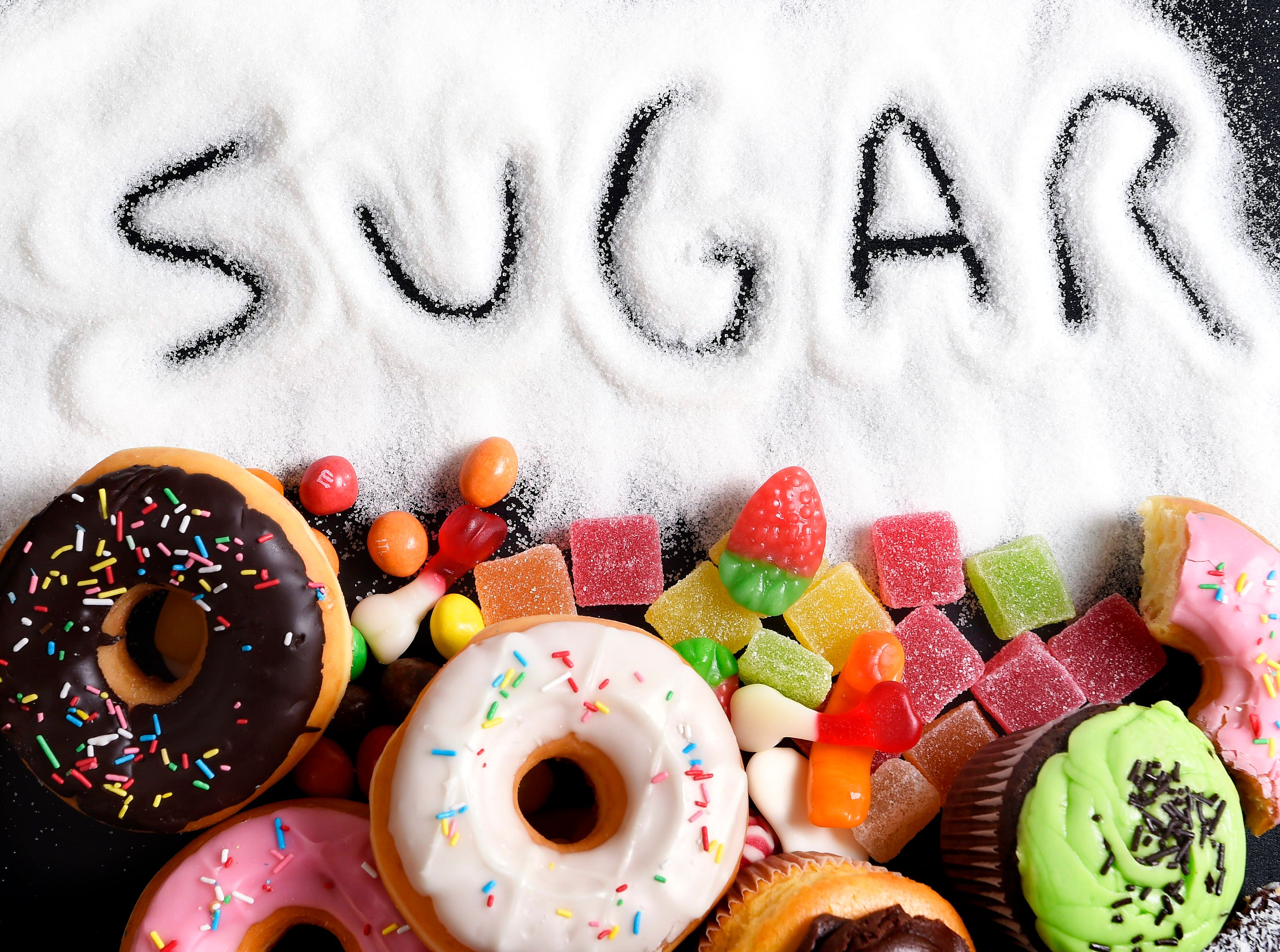 mix of sweet cakes, donuts and candy with sugar text