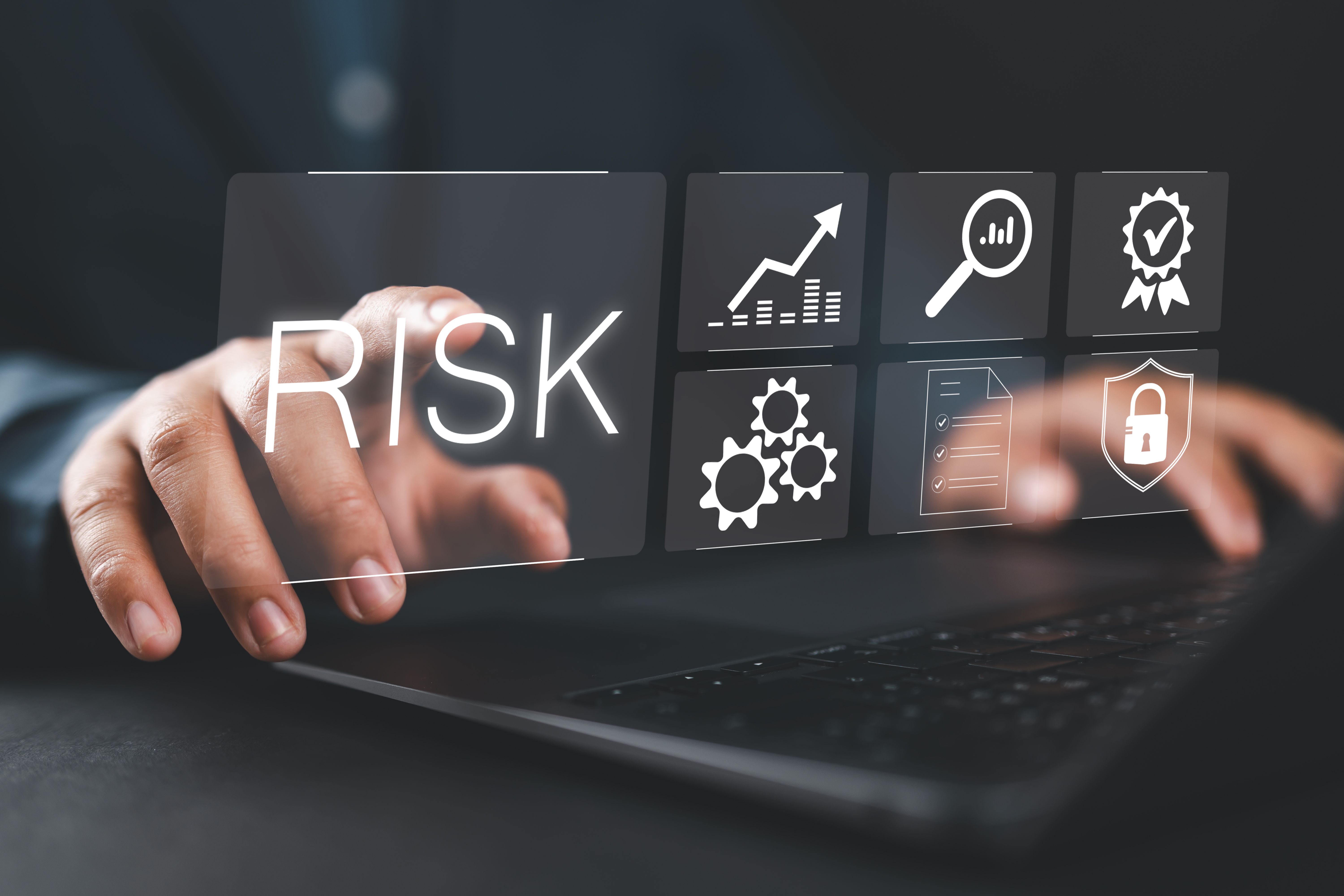 Risk management concept, risk assessment. Businessman using laptop to business and personal planning for risk mitigation with information and decision.