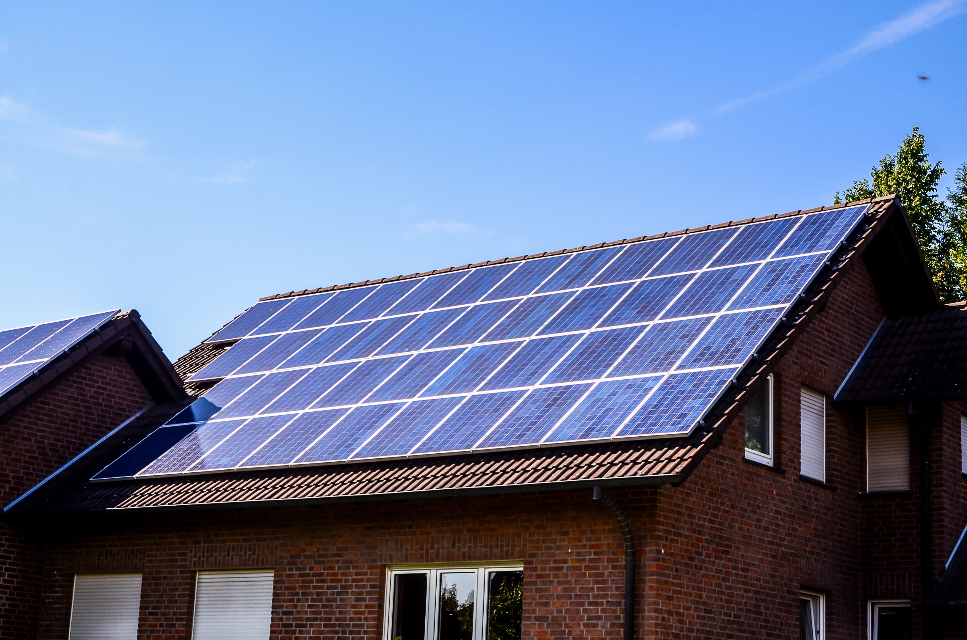 A house with a solar panel on the roof