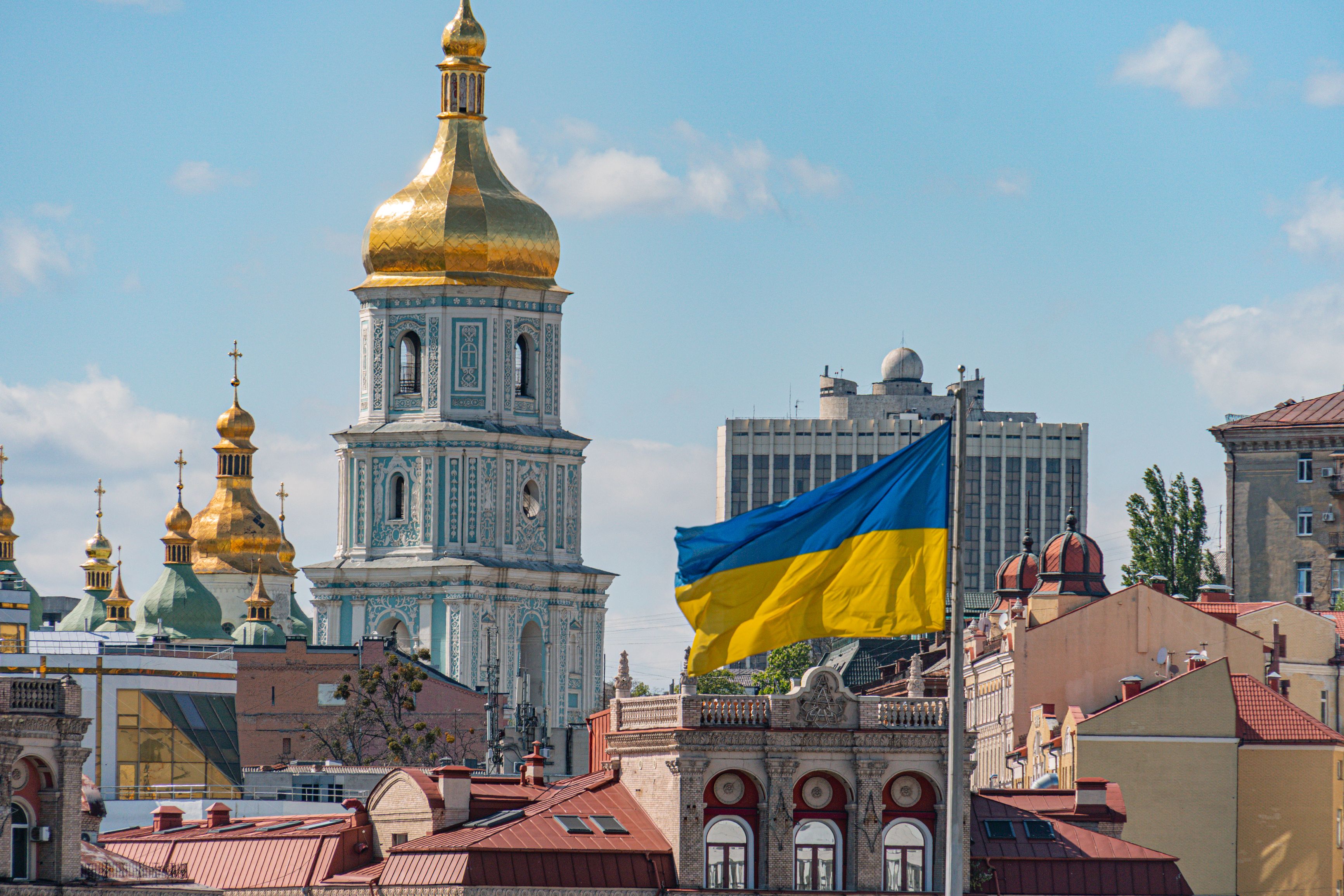 National symbols of Ukraine. Cityscape of Kiev, Ukraine on Independence Square, Independence Square, Maidan Nezalezhnosti, domes of St. Sophia's churches, yellow and blue flag National symbols of Ukraine. Cityscape of Kiev, Ukraine on Independence Square, Independence Square, Maidan Nezalezhnosti, domes of St. Sophia's churches, yellow and blue flag