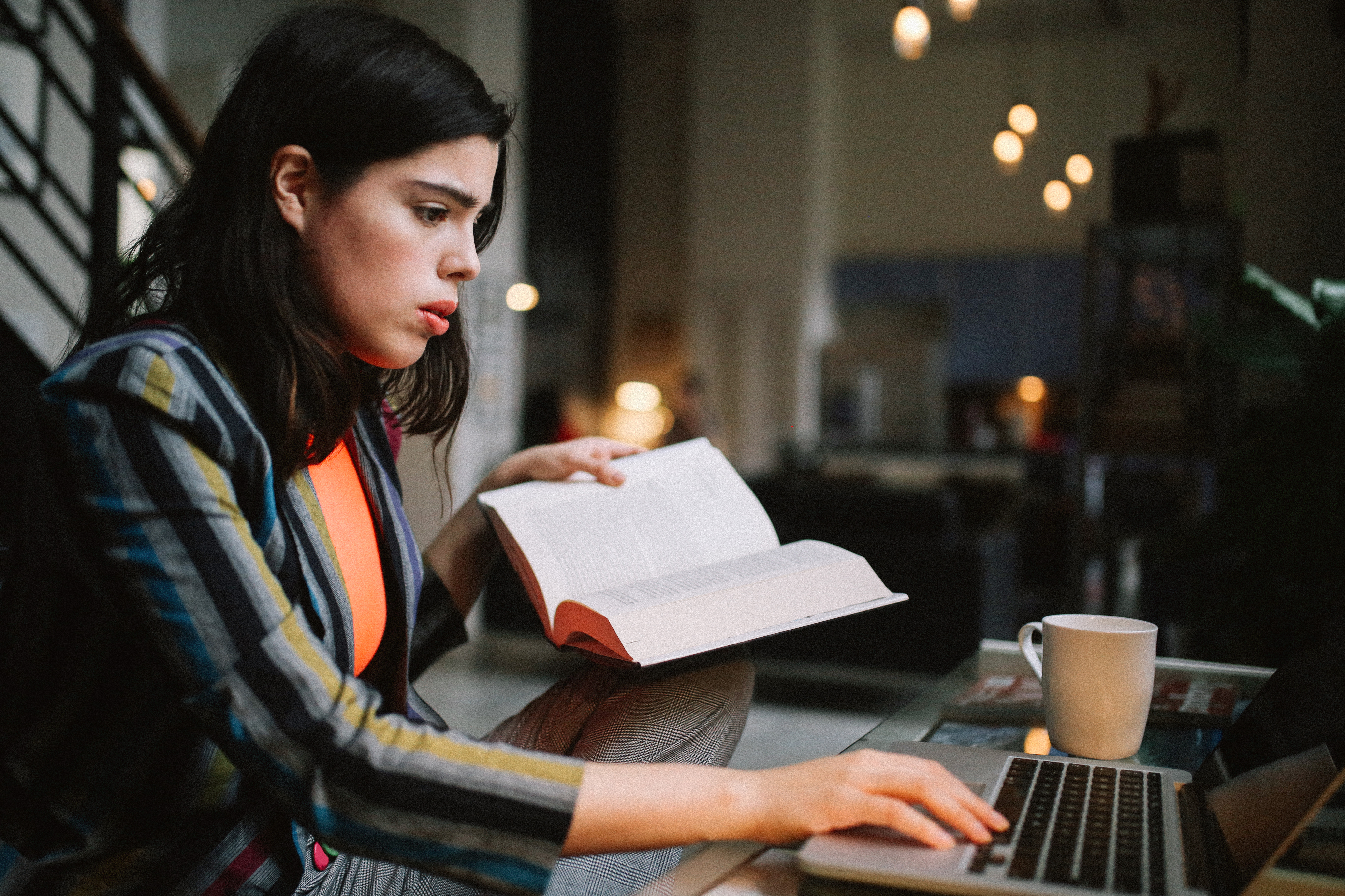 young woman doing her studies in Downtown Los Angeles apartment
