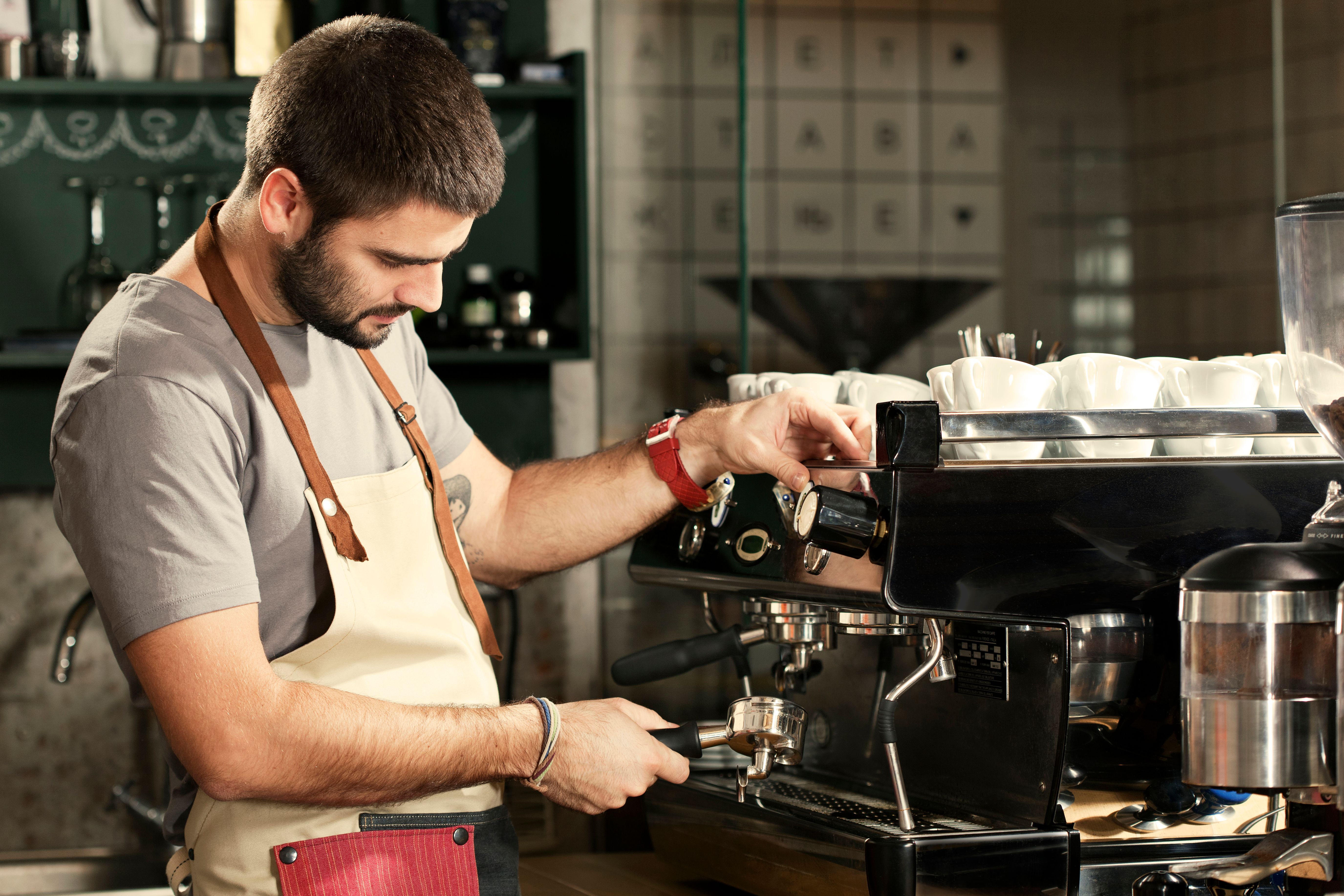 barista making coffee