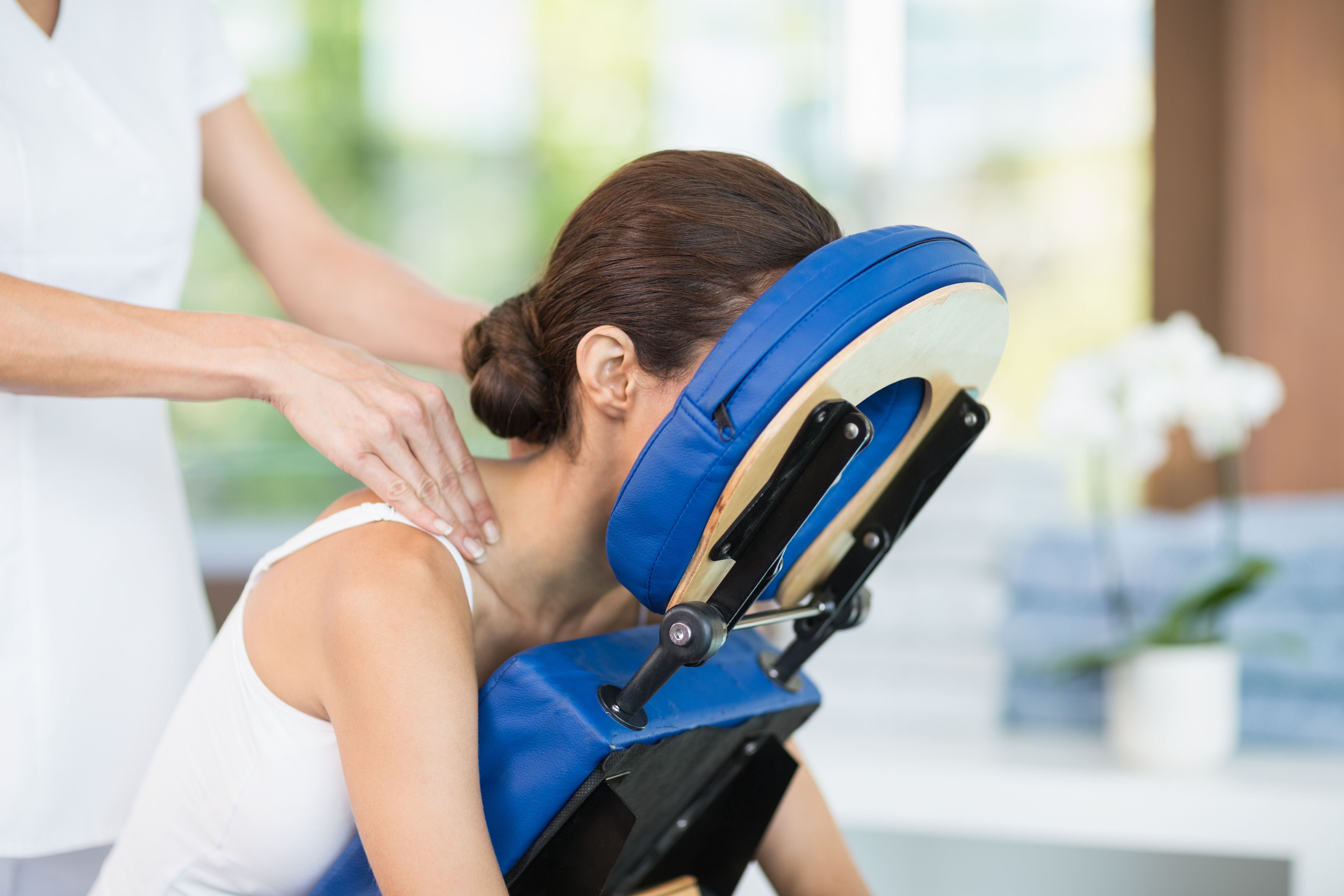 Young woman receiving back massage