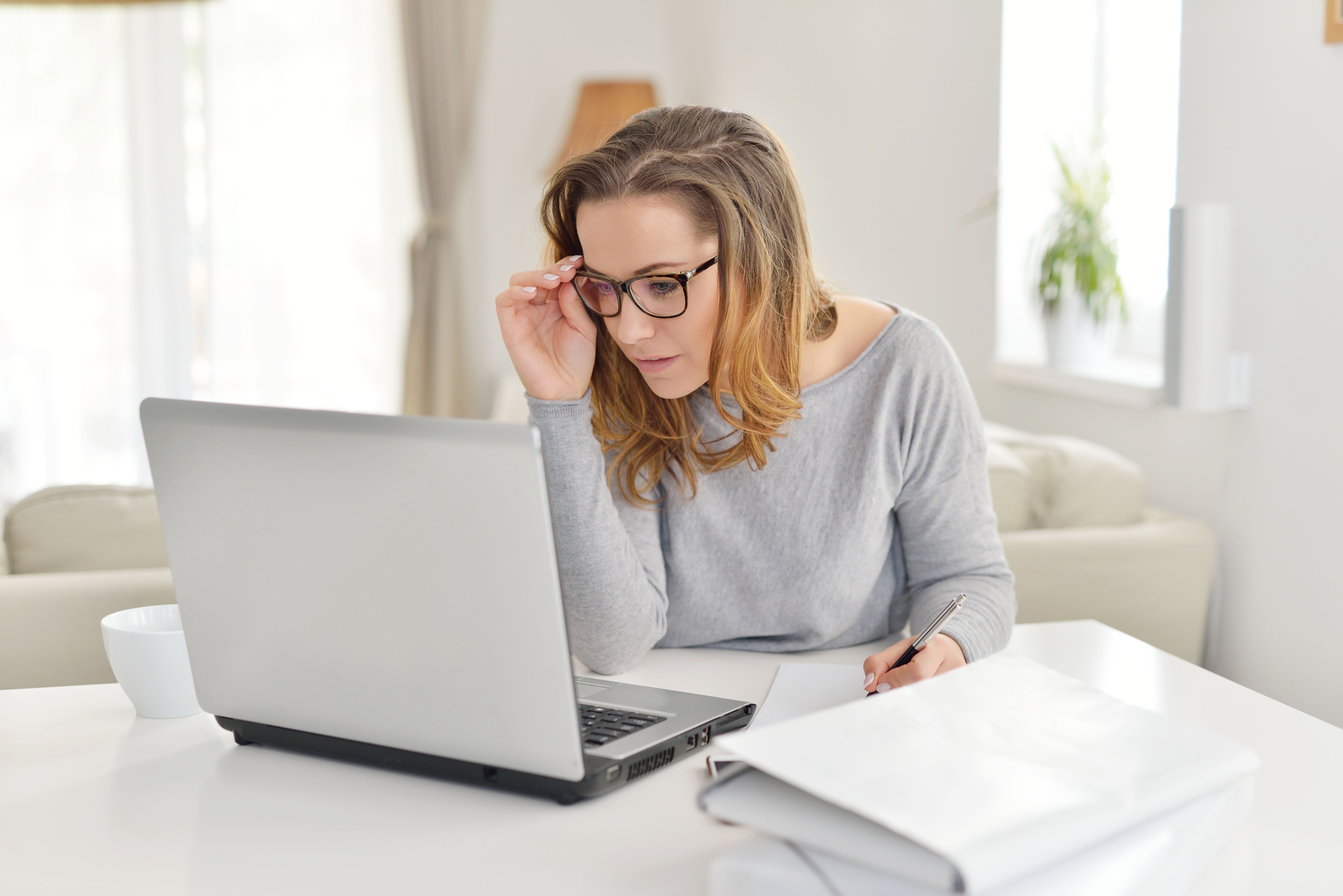 Using her laptop at home Using her laptop at home