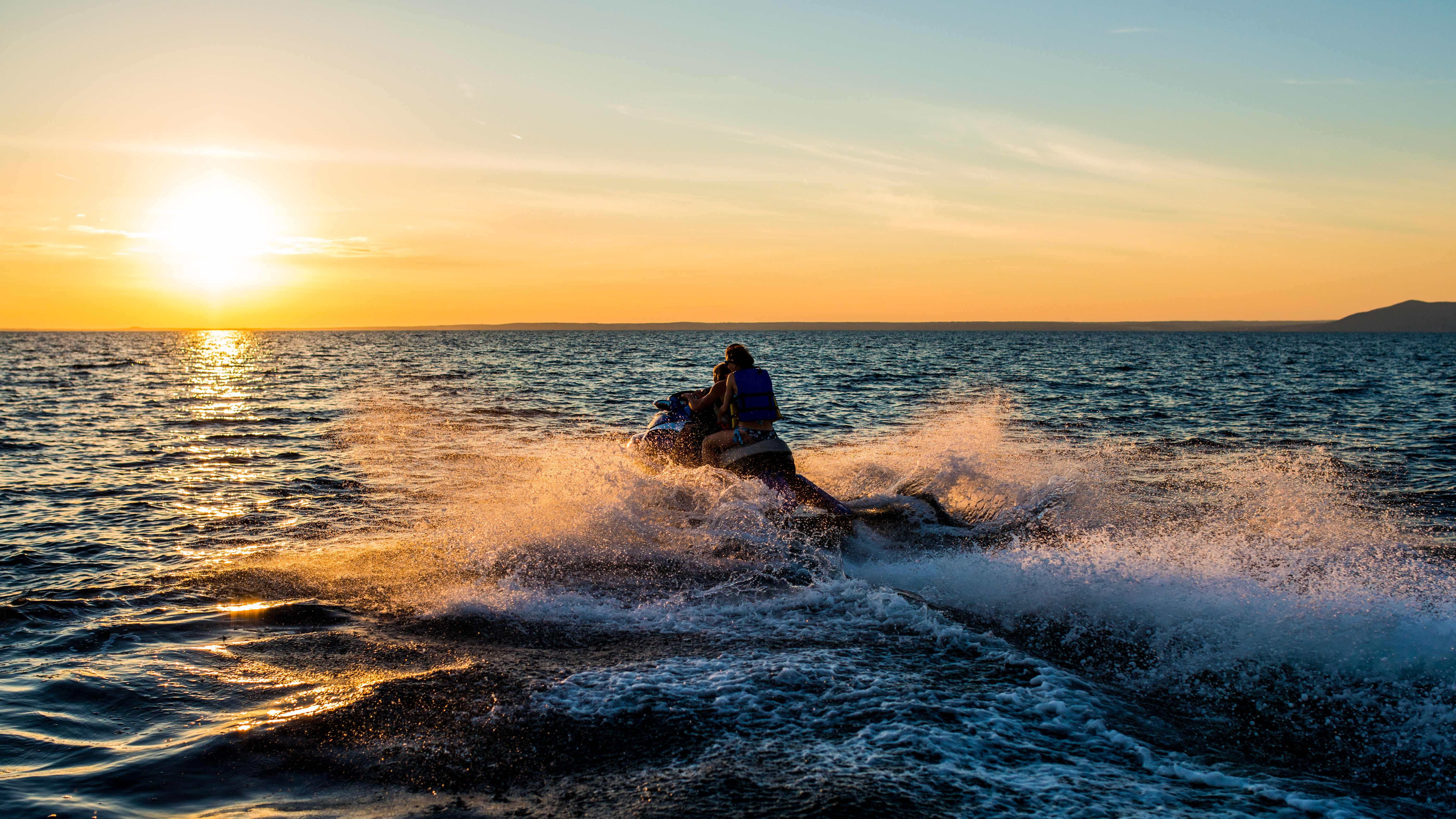 sunset jet skiing