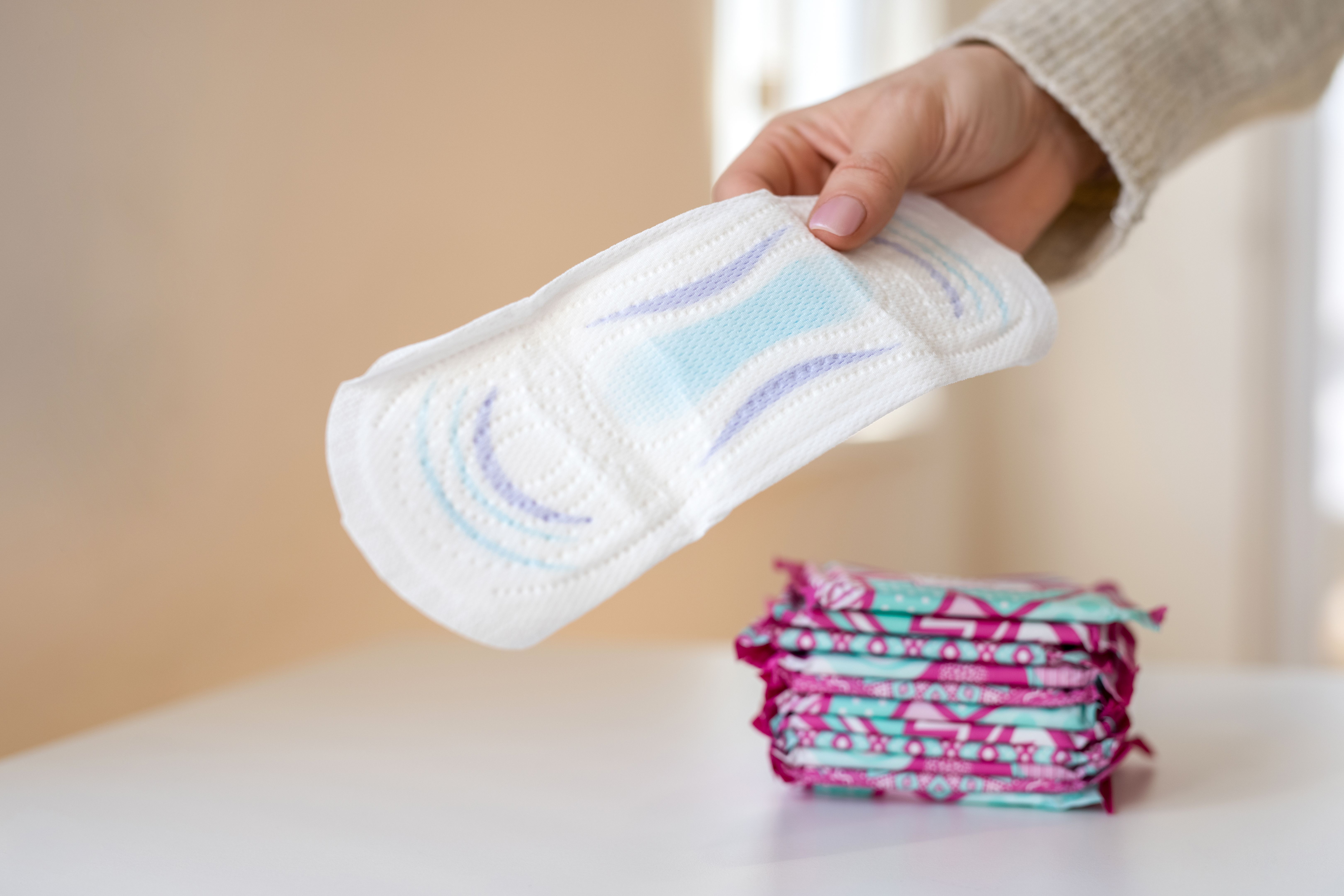 Woman holding a sanitary pad