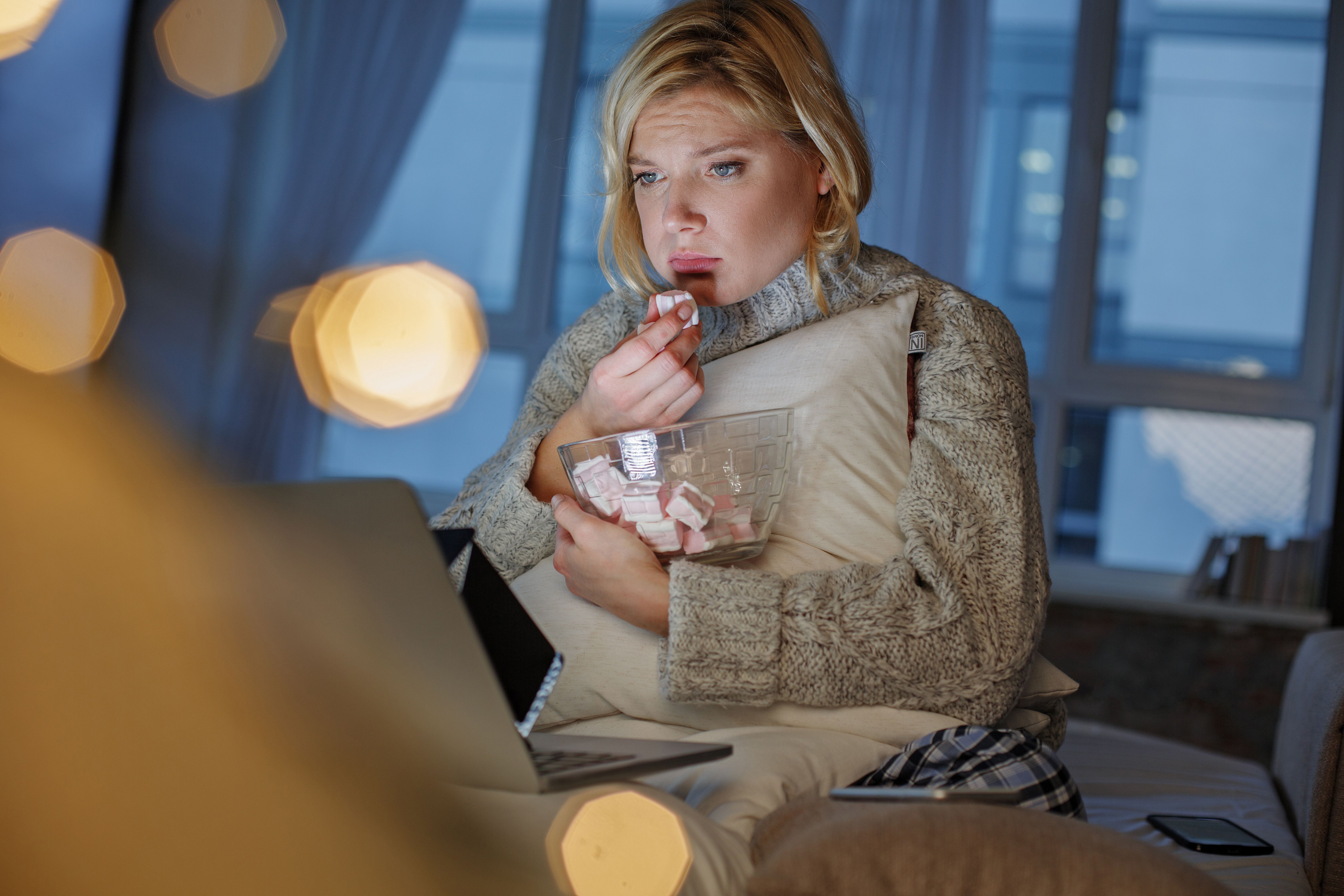 Pathetic girl observing sad film Pathetic girl observing sad film