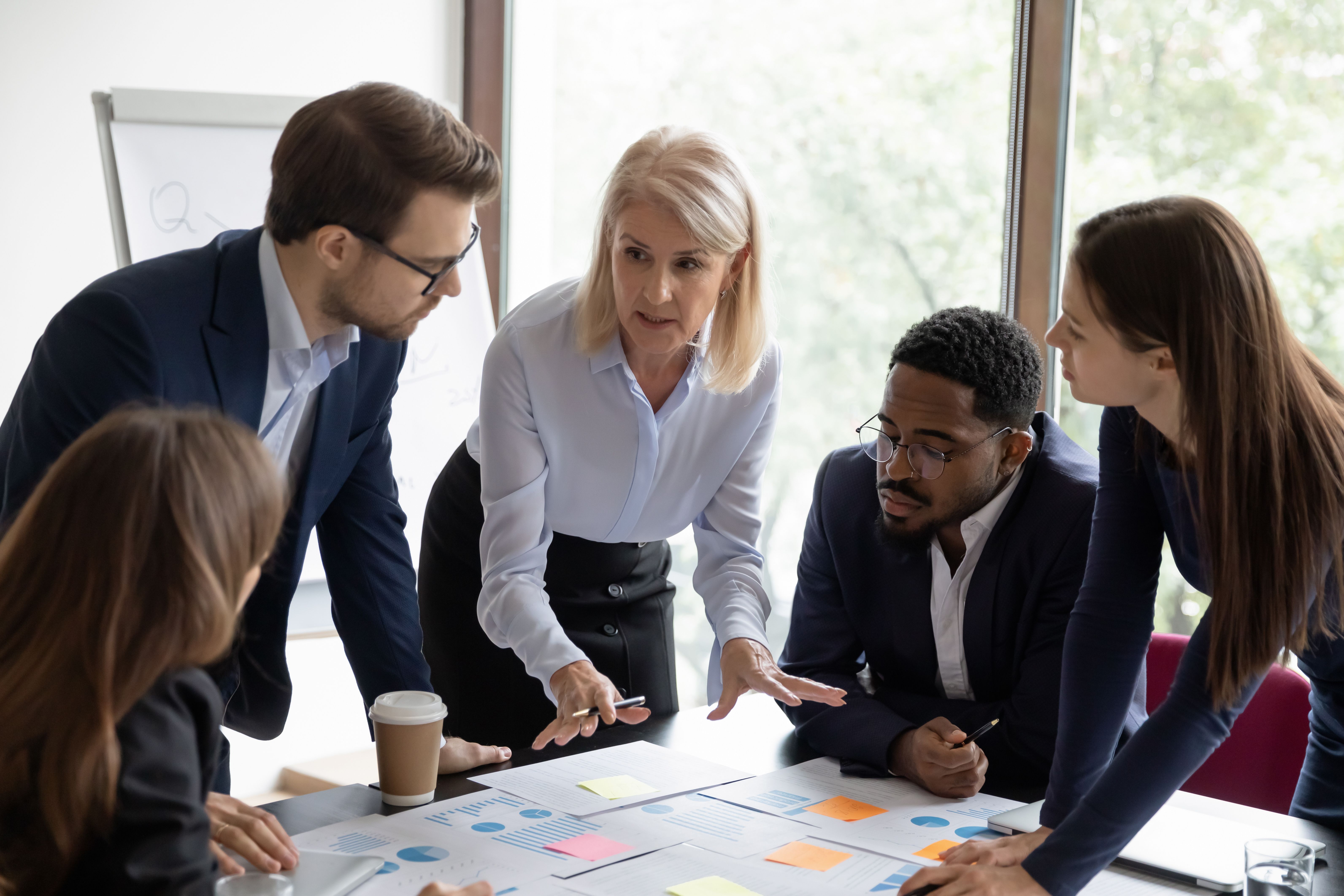 Mature business teacher training group of employees