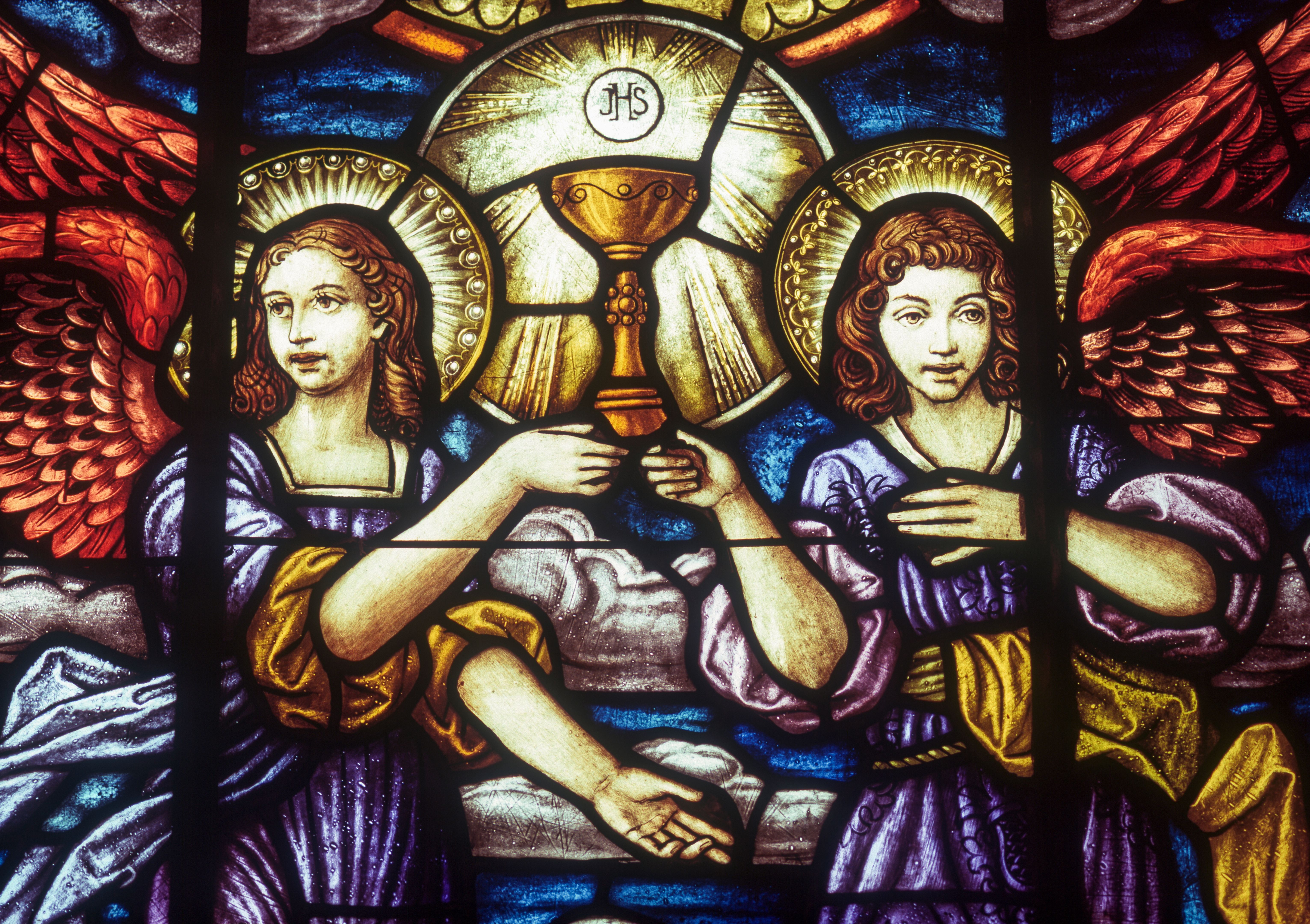 Stained glass of angels holding the Holy Grail