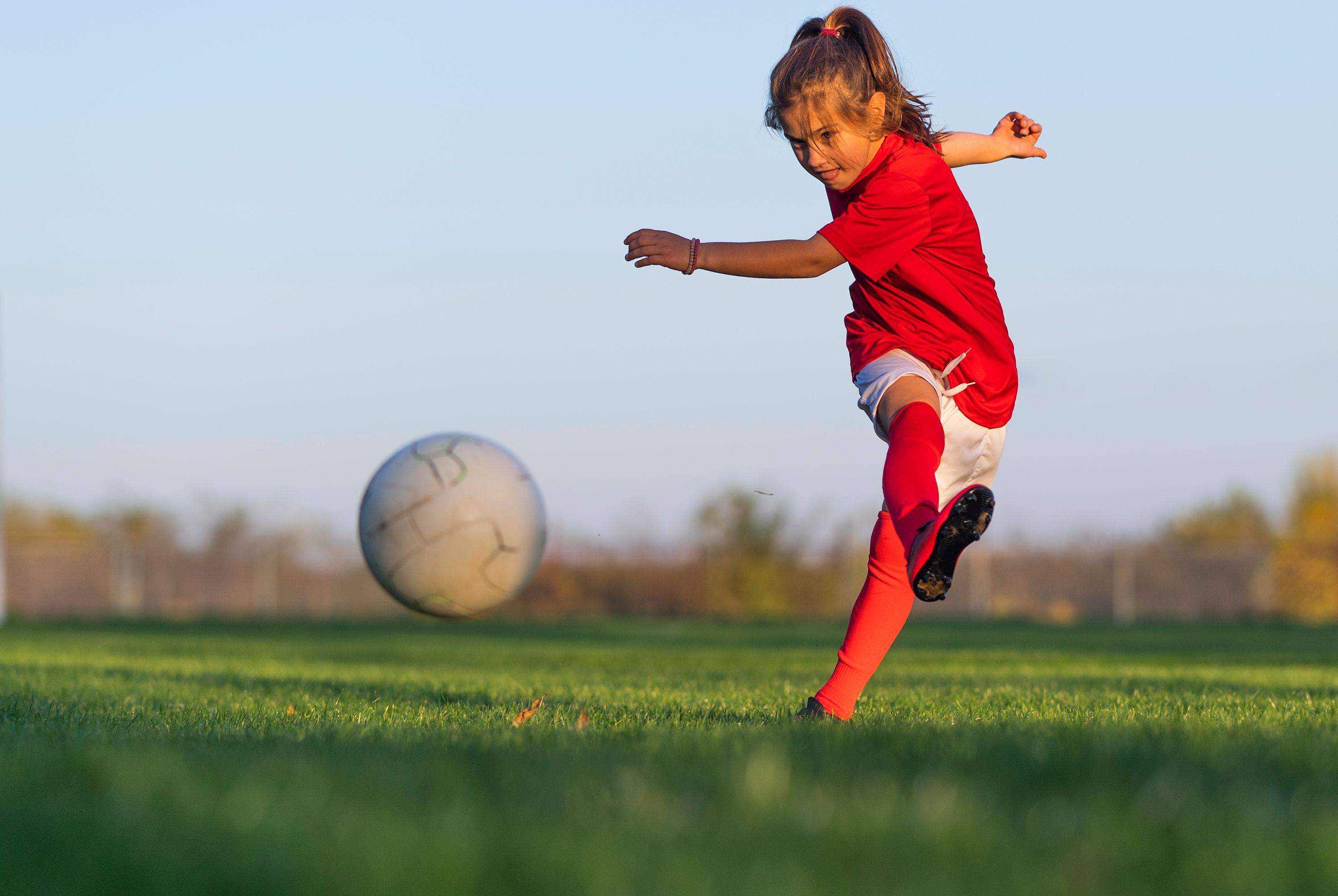 child playing soccer
