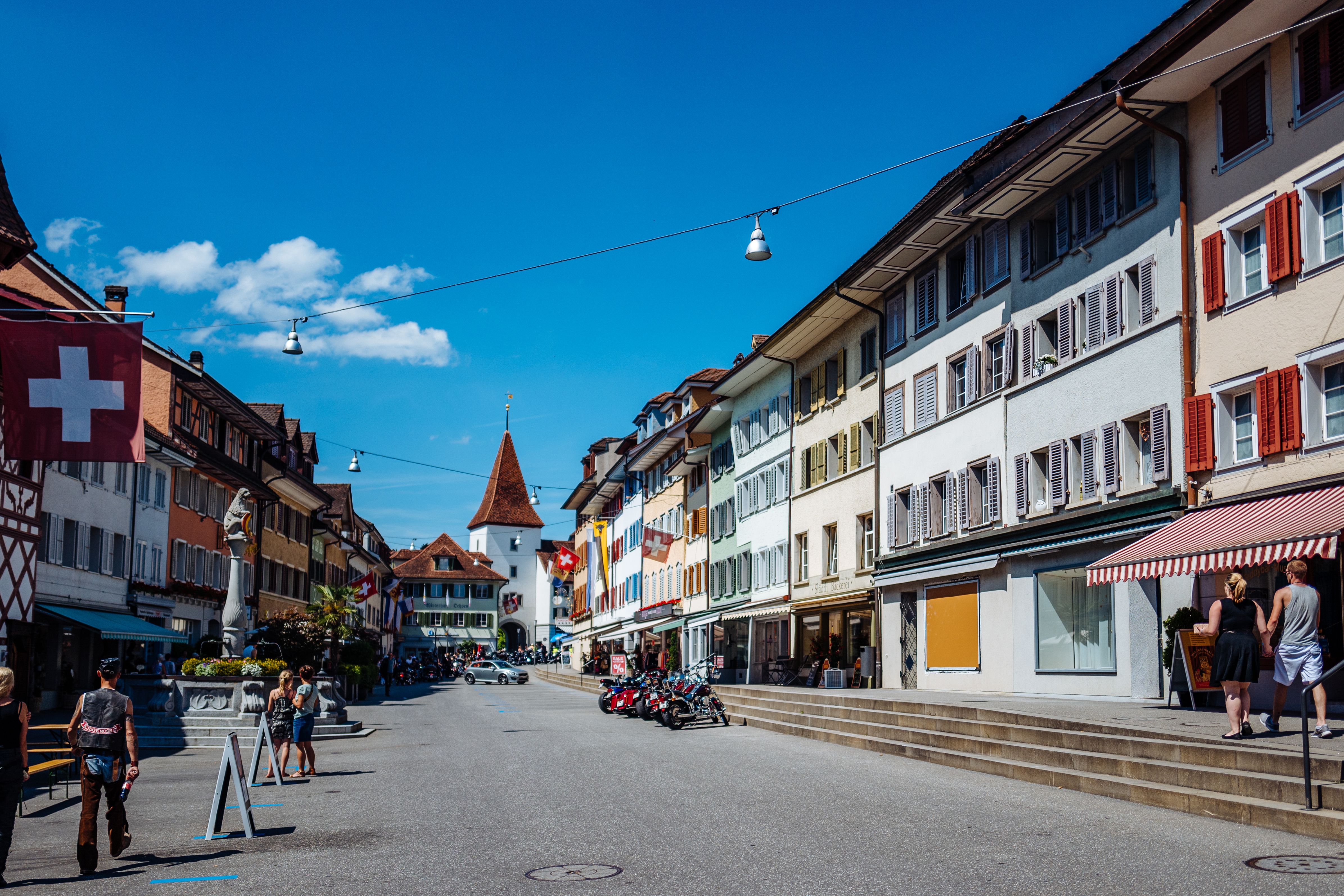 People On Street Against Blue Sky At Sempach