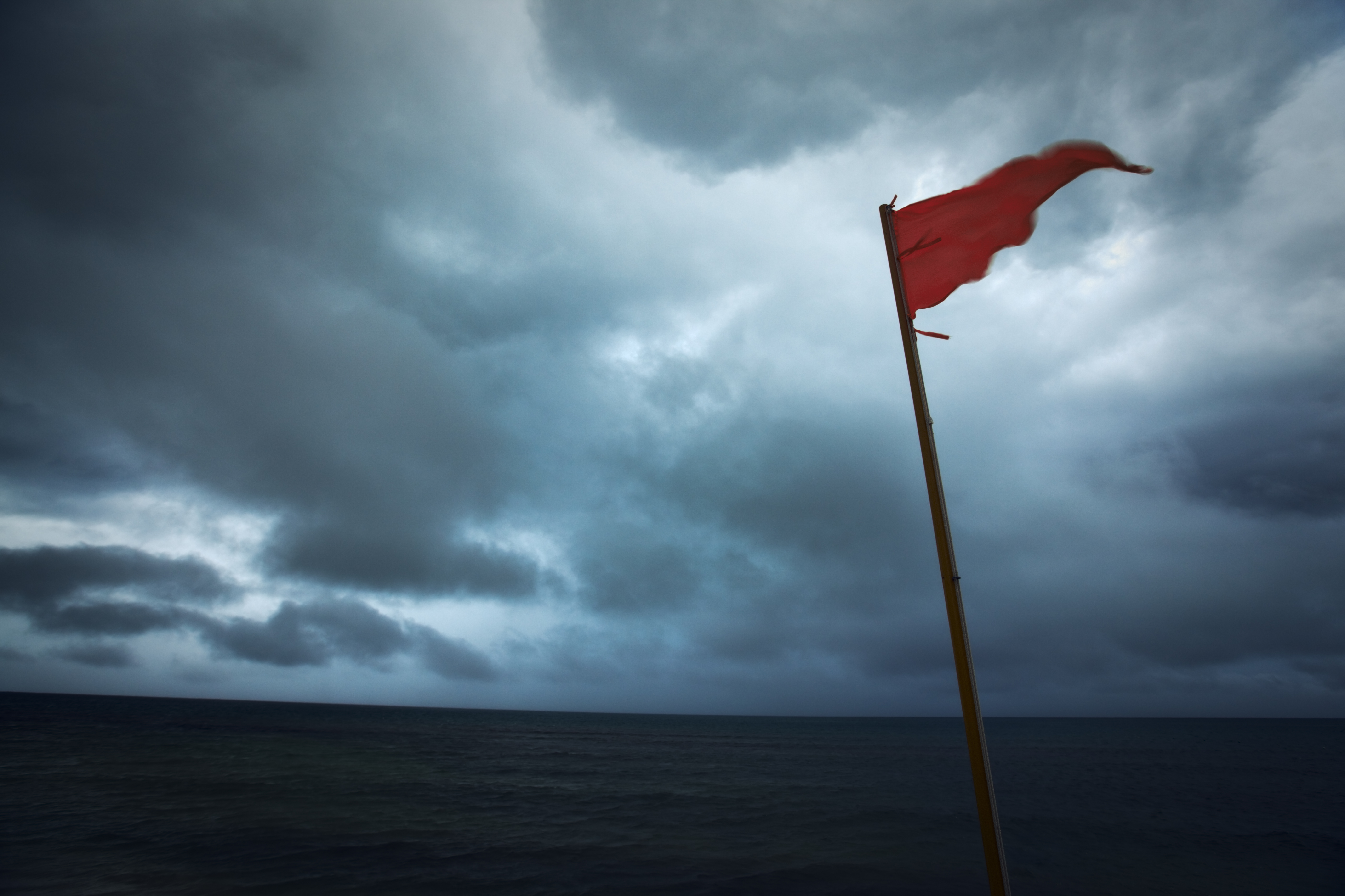 Red Flag Warning Hurricane Storm Danger of Dark Sea Clouds Red Flag Warning Hurricane Storm Danger of Dark Sea Clouds