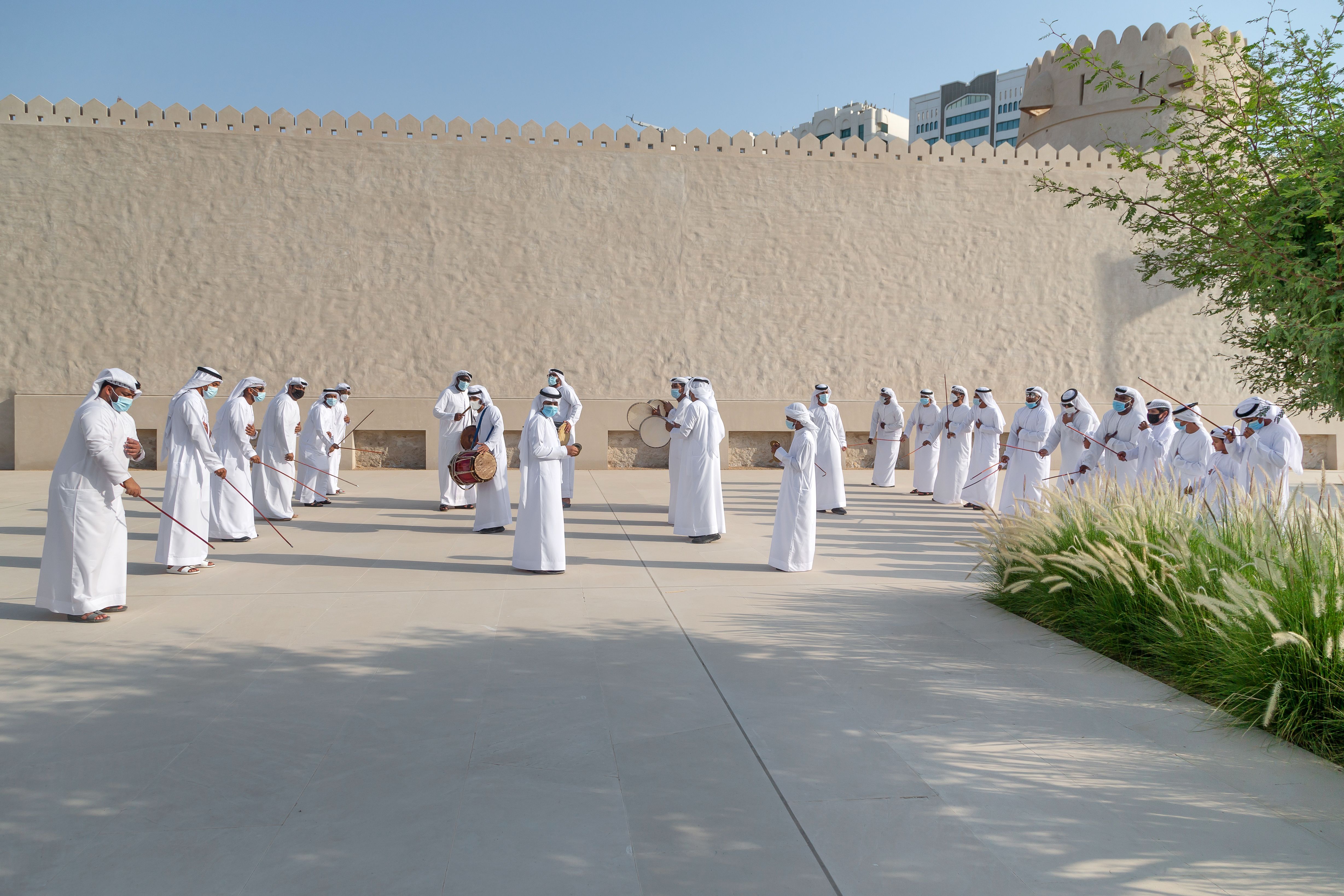 ABU DHABI, UAE - MAY 14, 2021: Traditional Emirati male Al Ayalah dance at Al Hosn Festival