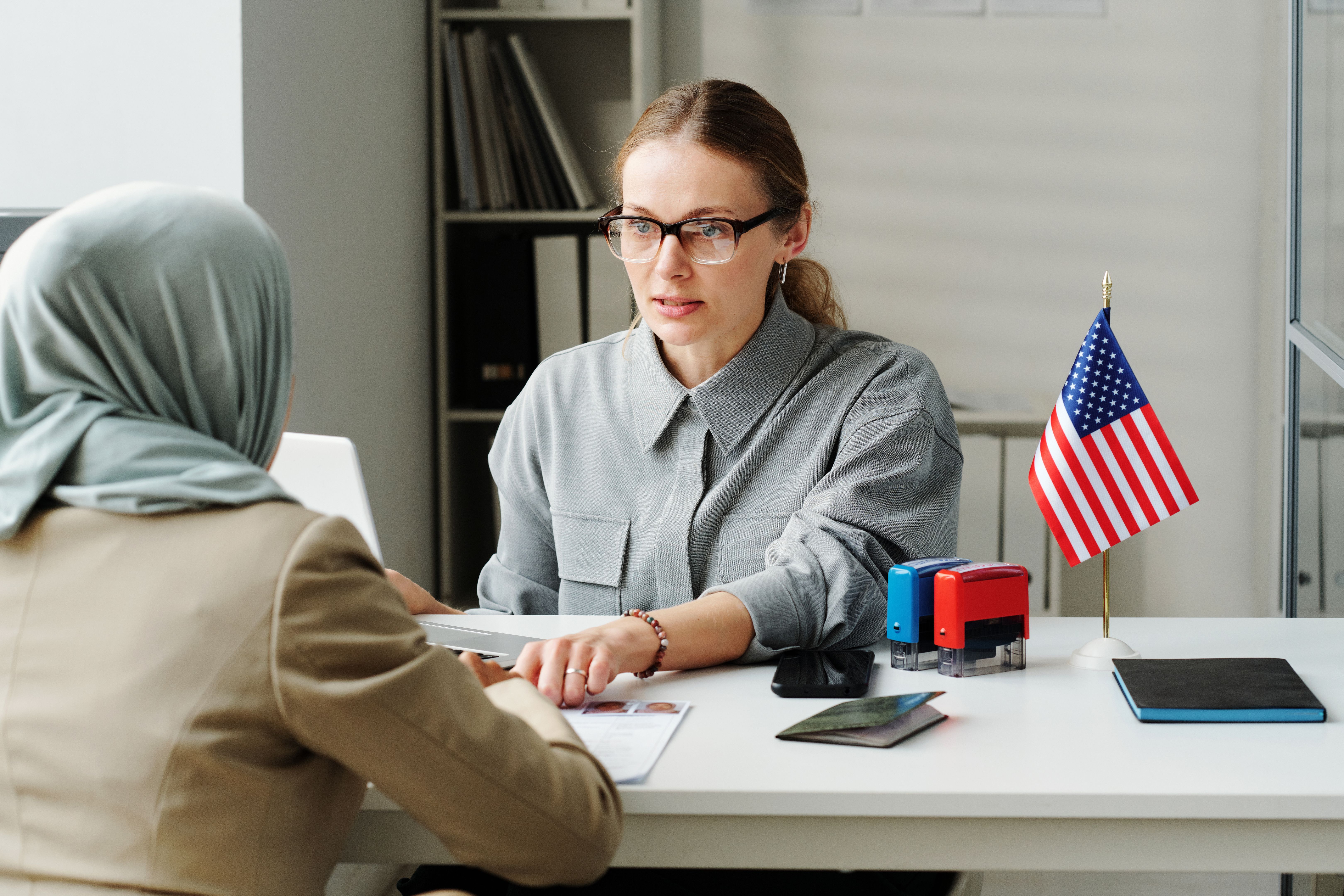 Consular officer assisting a client