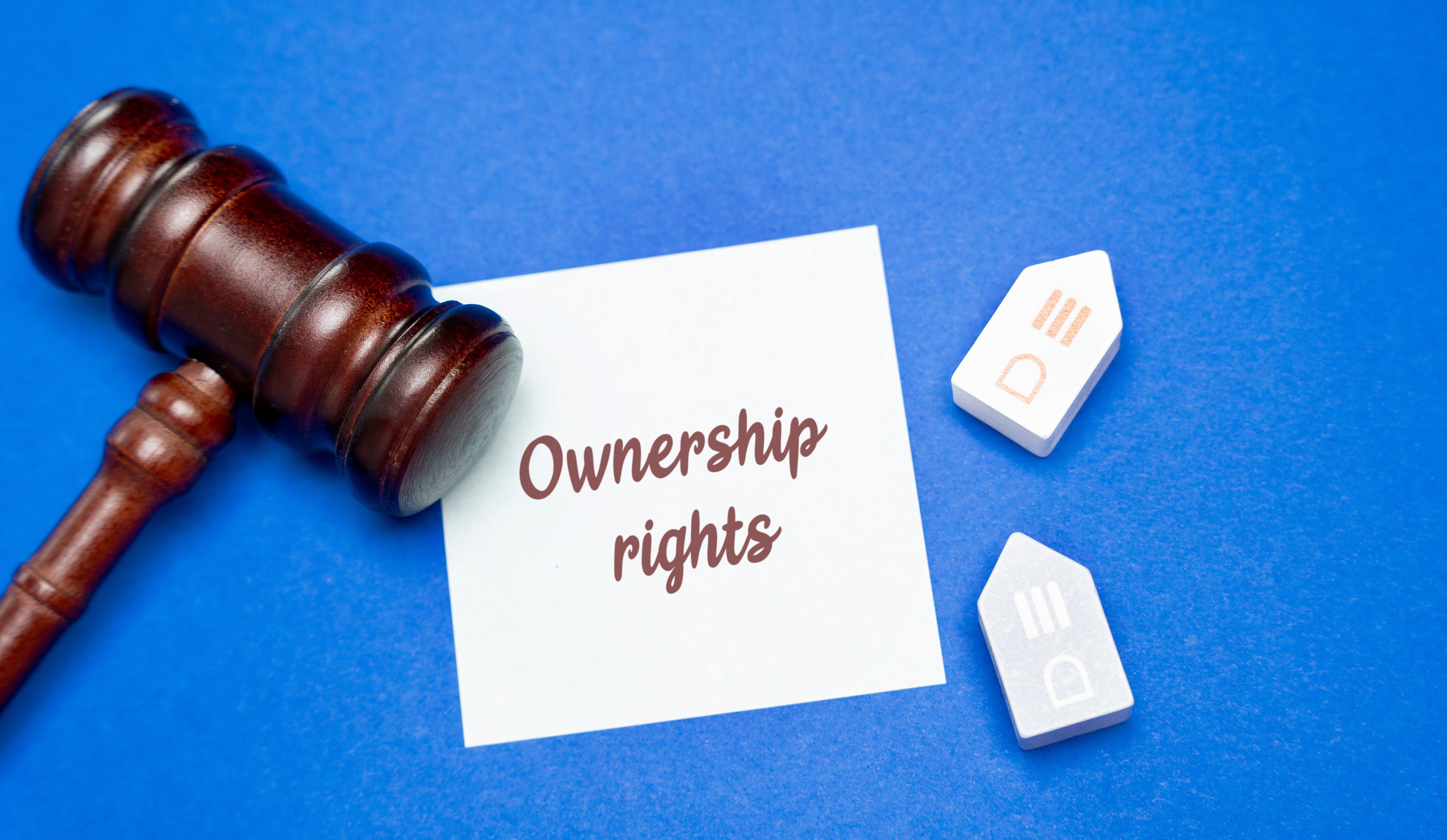 Ownership rights in housing concept. Legal rights of an individual or entity to possess, use, and control a residential property. Court and real estate Ownership rights in housing concept. Legal rights of an individual or entity to possess, use, and control a residential property. Court and real estate