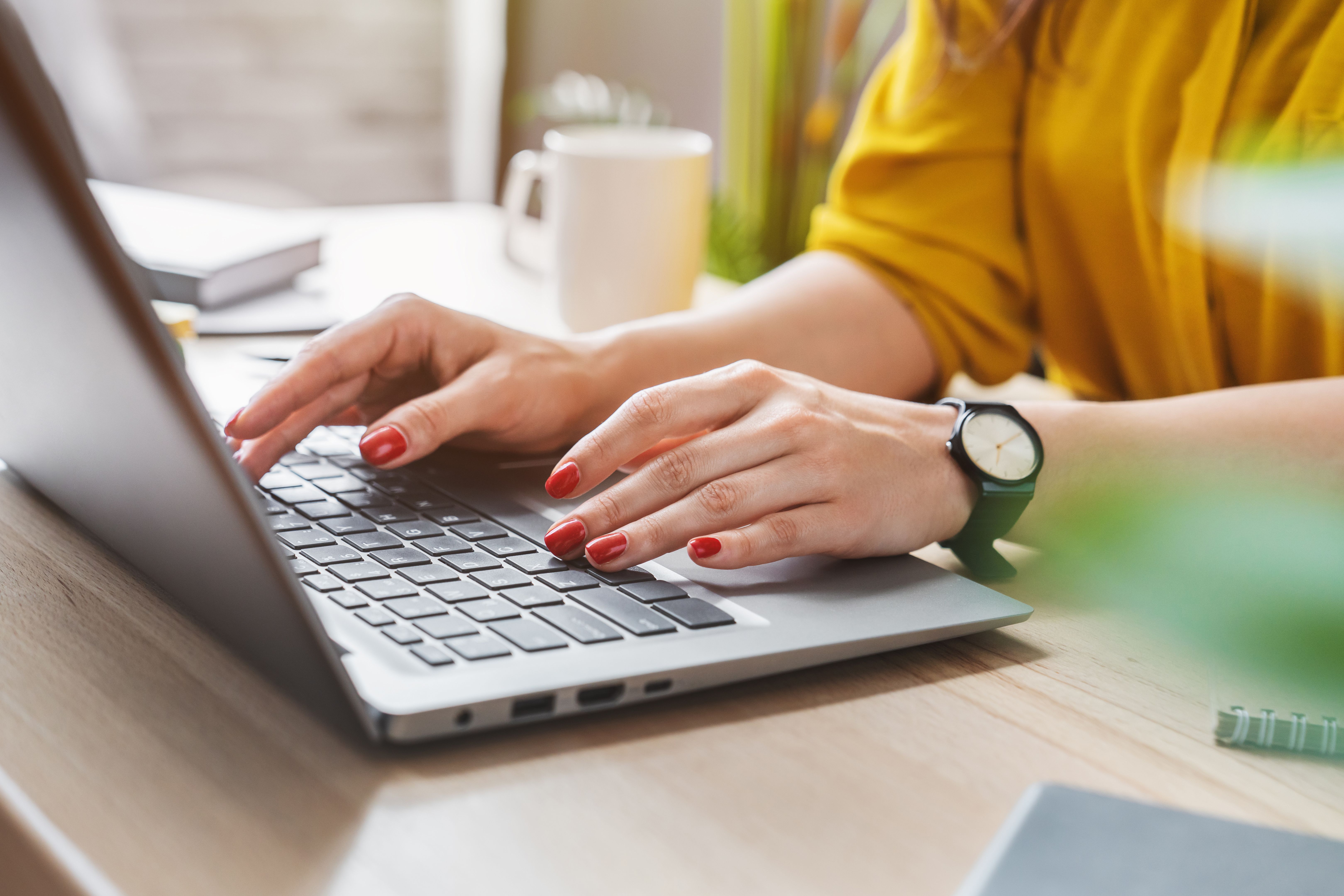 woman typing on laptop