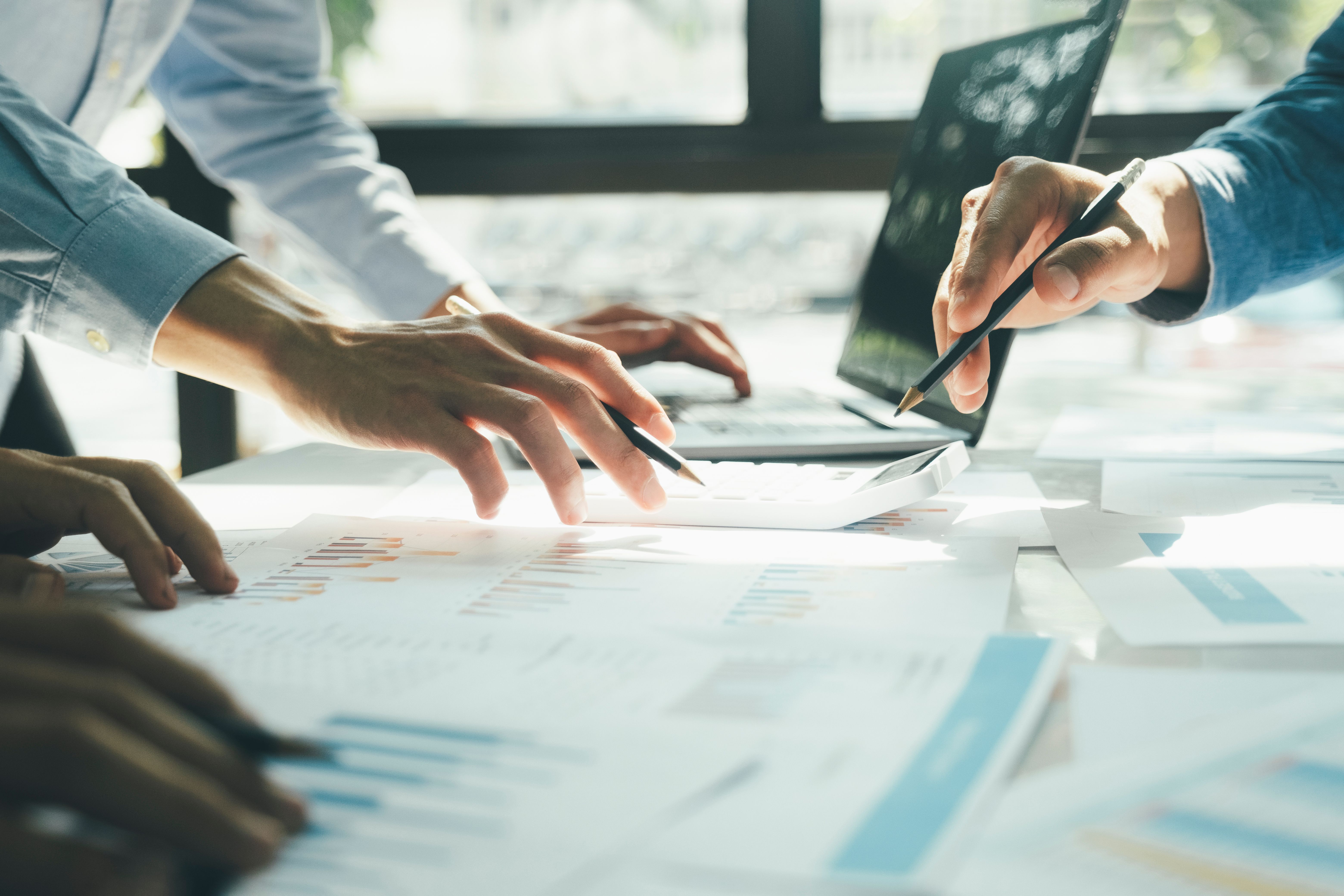 Businessmen working together using laptop Businessmen working together using laptop