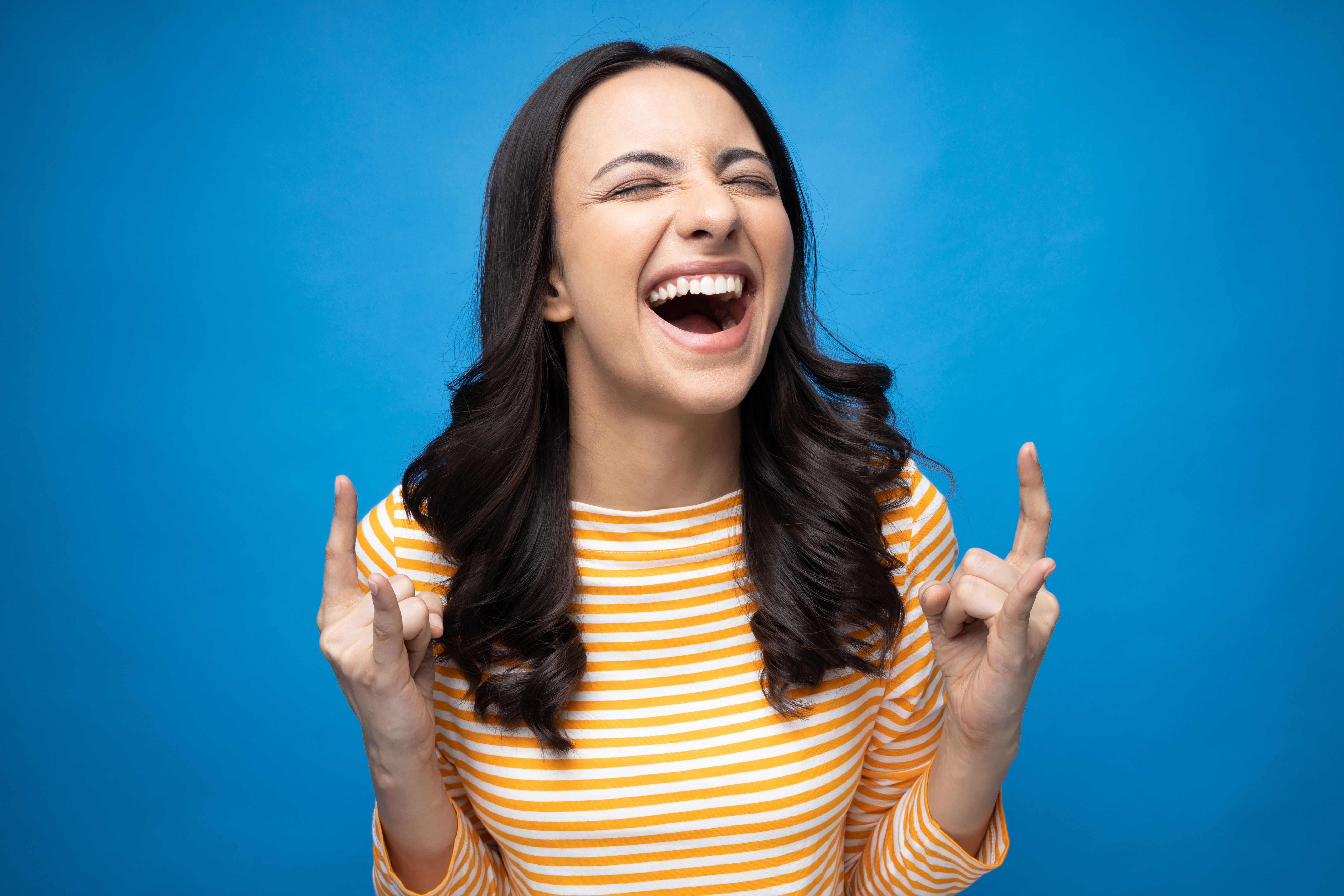 Portrait of young woman wear trendy smart casual outfit isolated on blue background stock photo