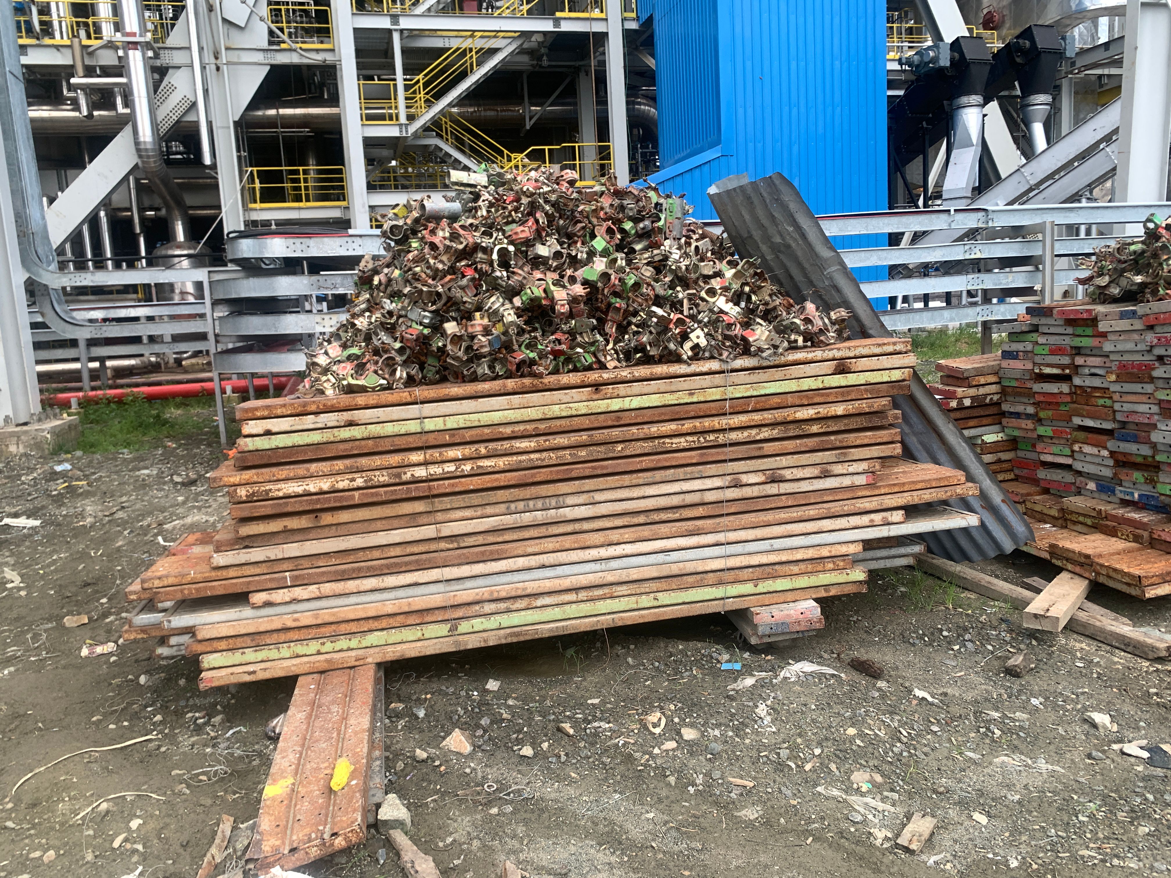 Lot of Asiba scaffolding and double clamp lay on the site power plant area. Lot of Asiba scaffolding and double clamp lay on the site power plant area.