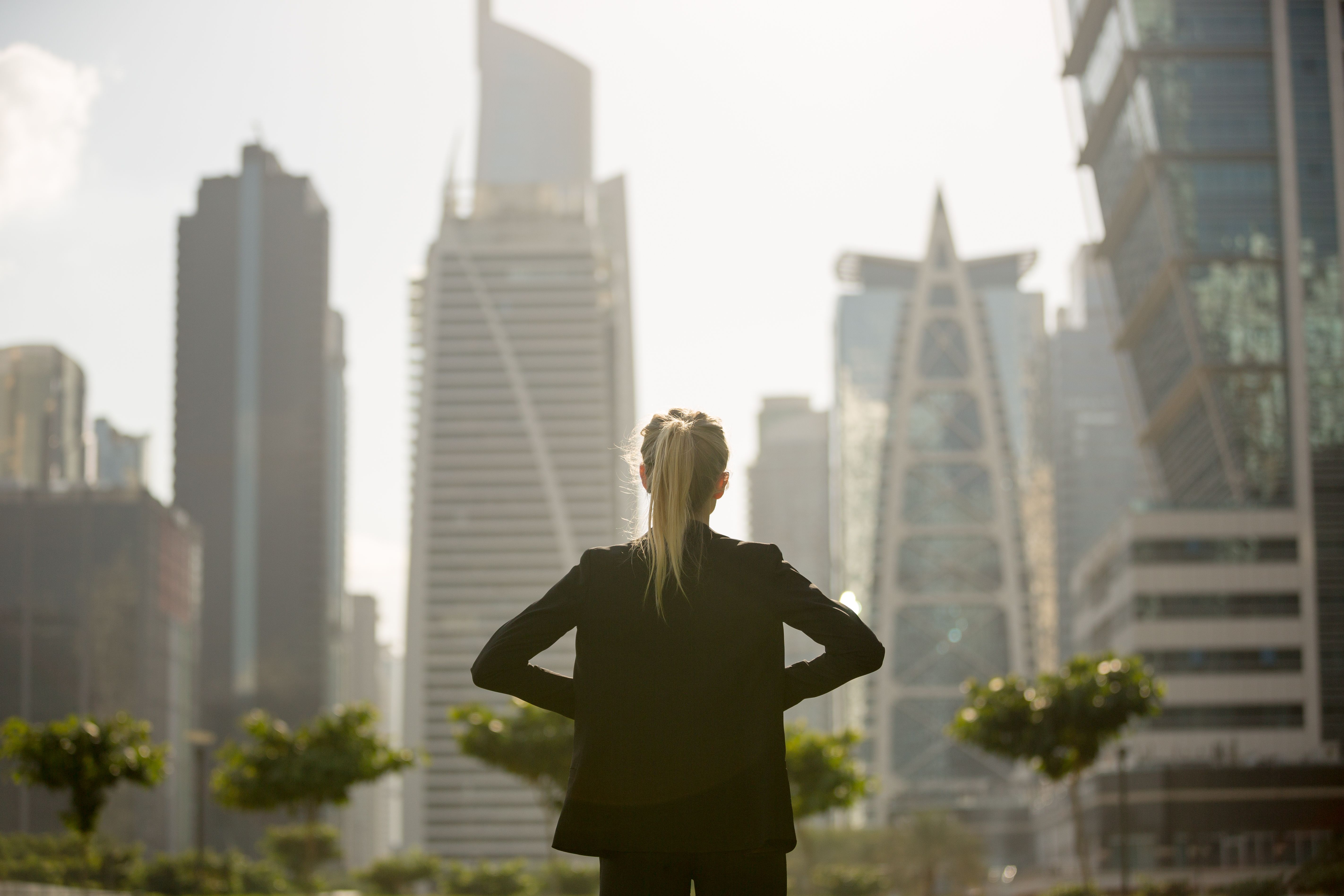 Ambitious businesswoman standing confident and strong in the city.