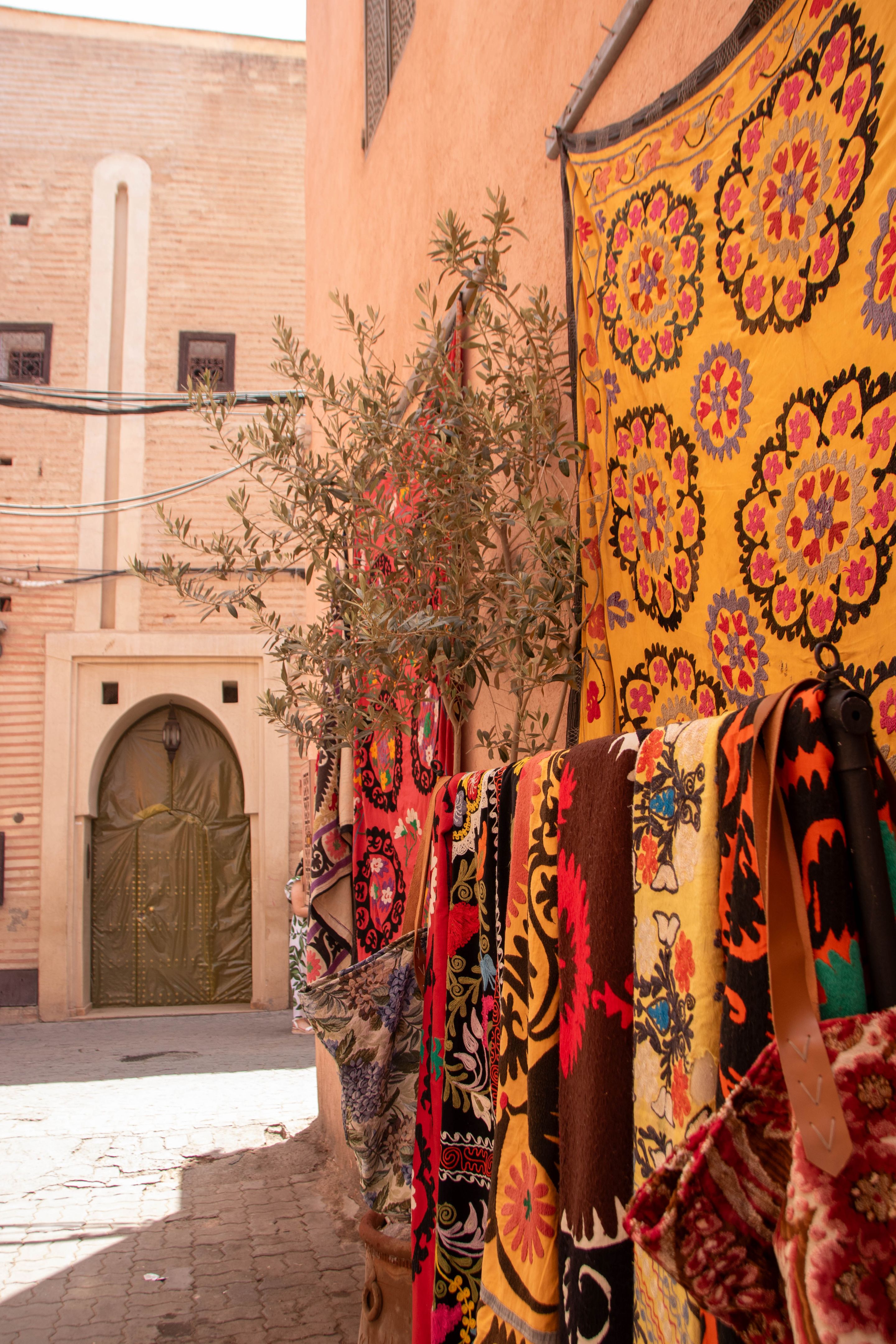 handcrafted carpets hanging in the Medina of Marrakech