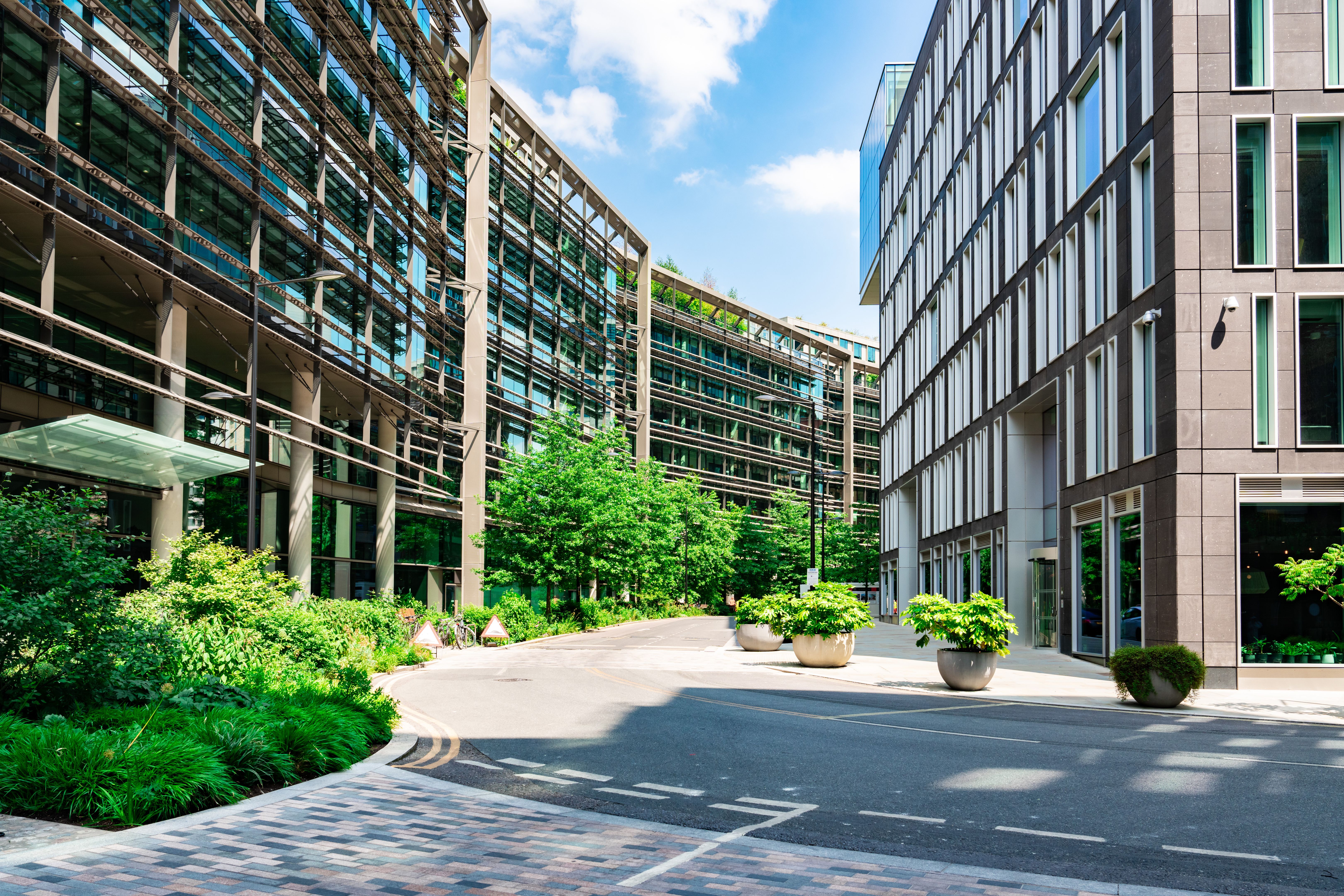 Modern office buildings and lush greenery in london's business district