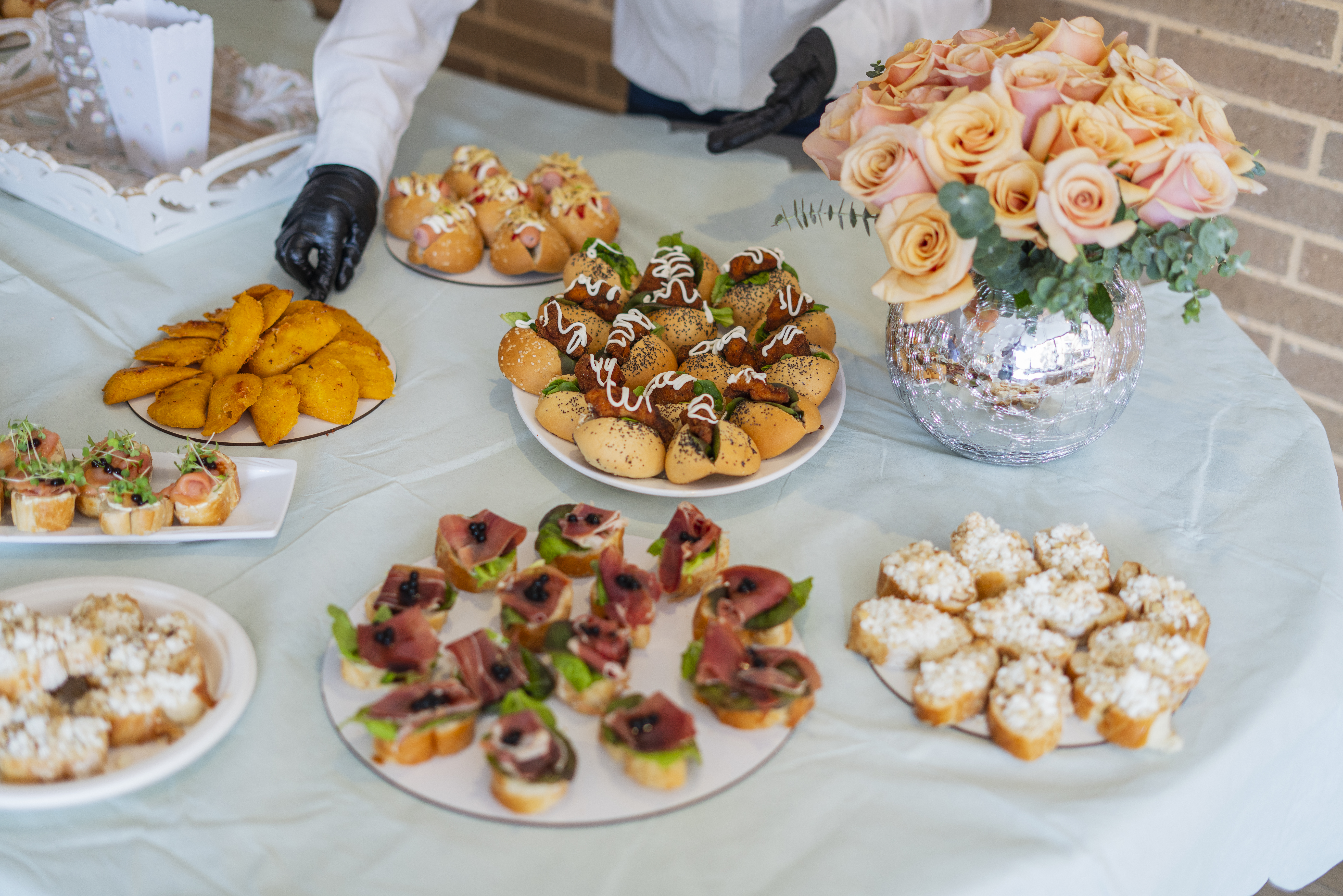 Women waitresses by profession are within the facilities of a Veneto organizing the decoration and food table