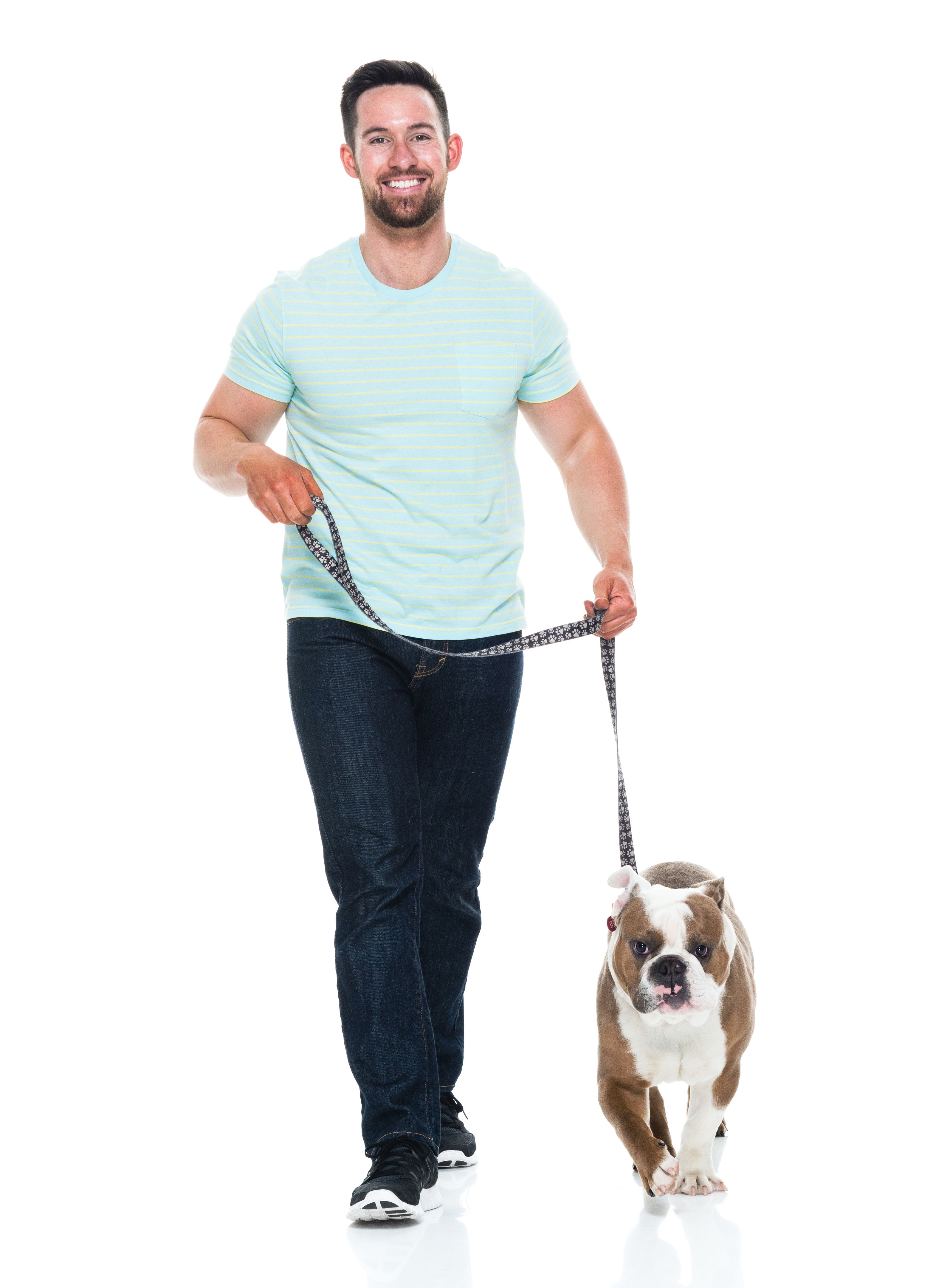Happy young man playing with his bulldog